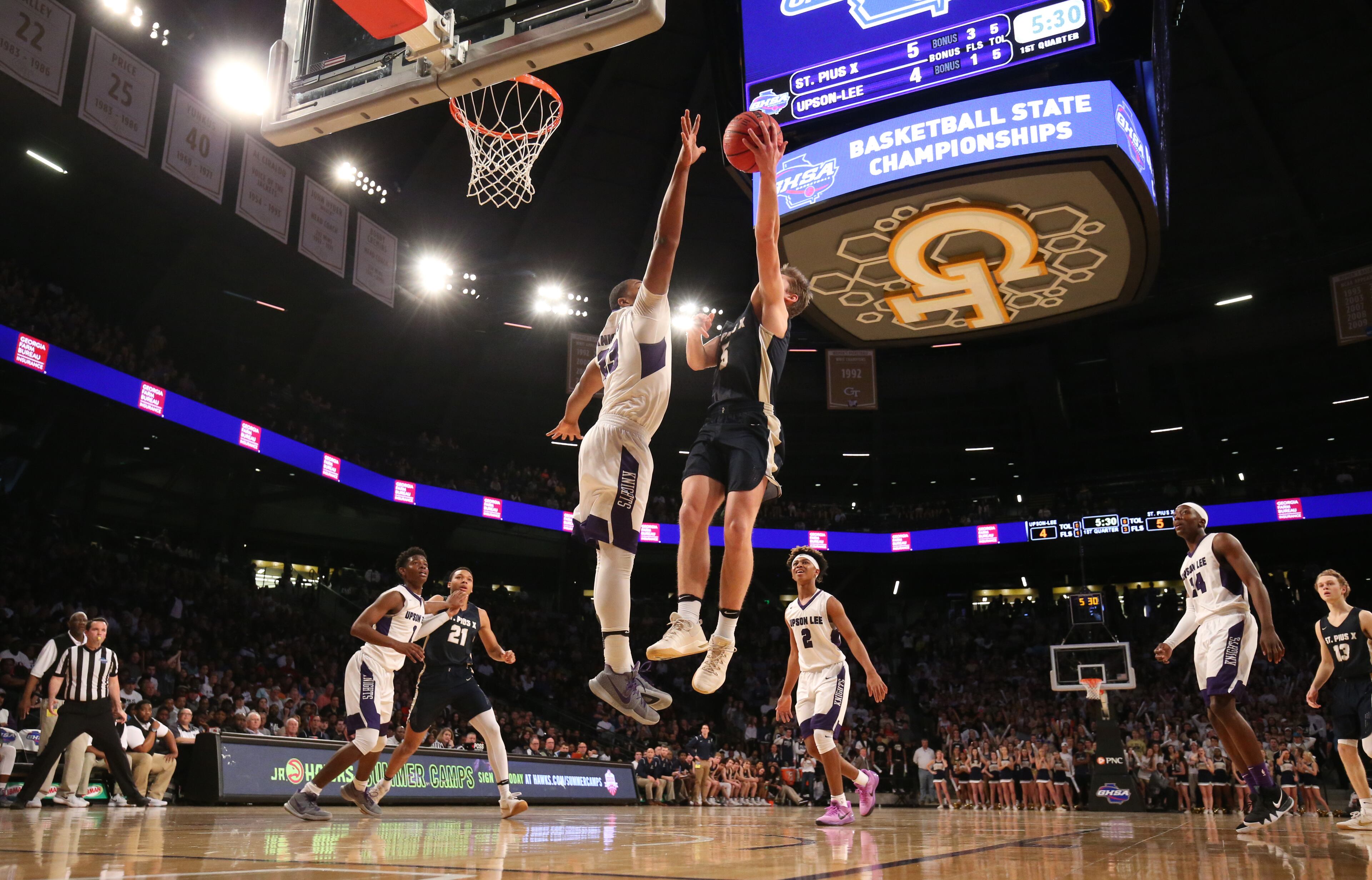 March 10, 2018 - Atlanta, Ga: St. Pius guard Niko Broadway (5) attempts a shot against Upson-Lee forward Travon Walker (23) during the first half of the GHSA Class AAAA Boys State Championship at McCamish Pavilion Saturday, March 10, 2018, in Atlanta. PHOTO / JASON GETZ