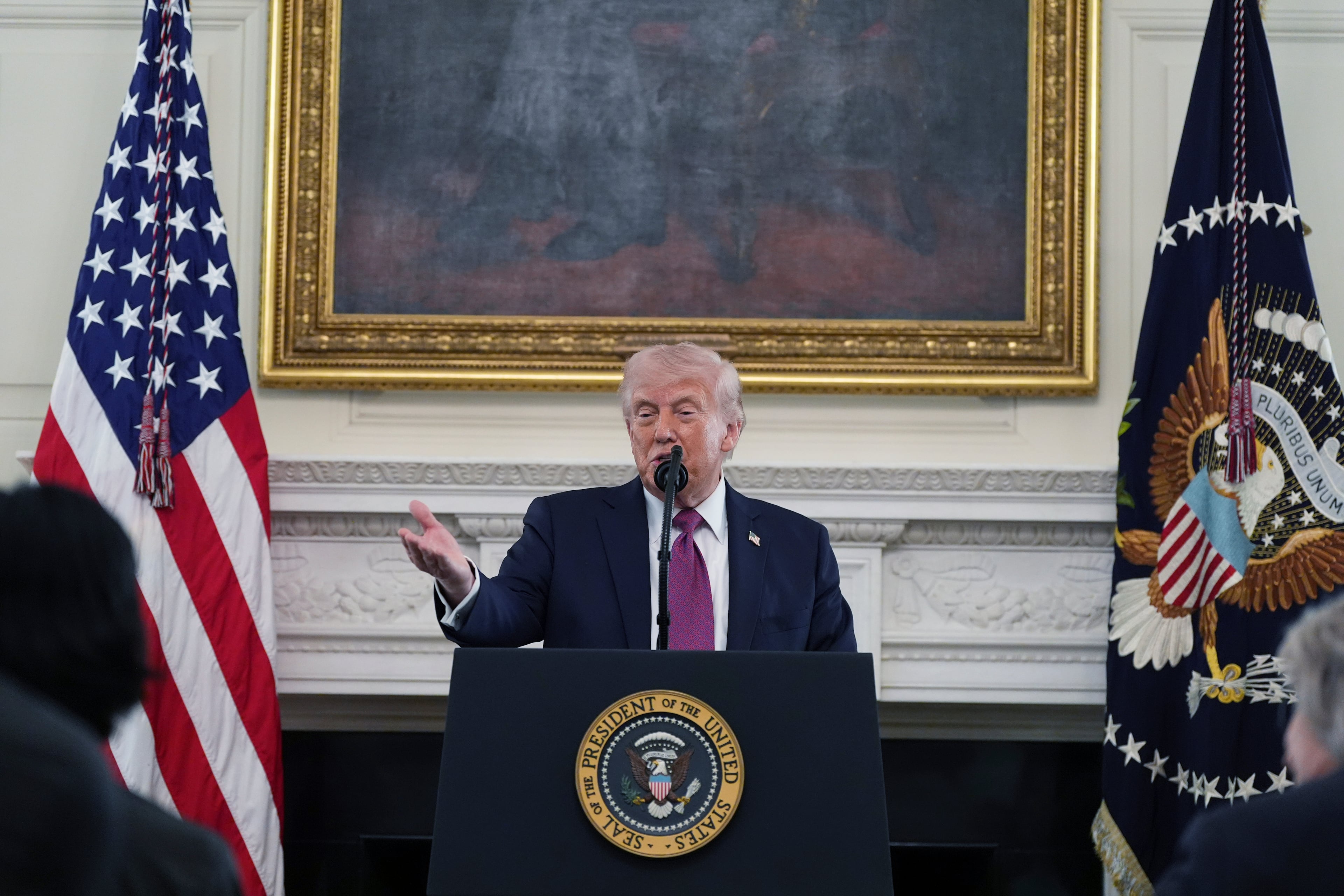 President Donald Trump speaks during an event for NCAA national champions in the State Dining Room of the White House on Tuesday. (Brandon/AP)