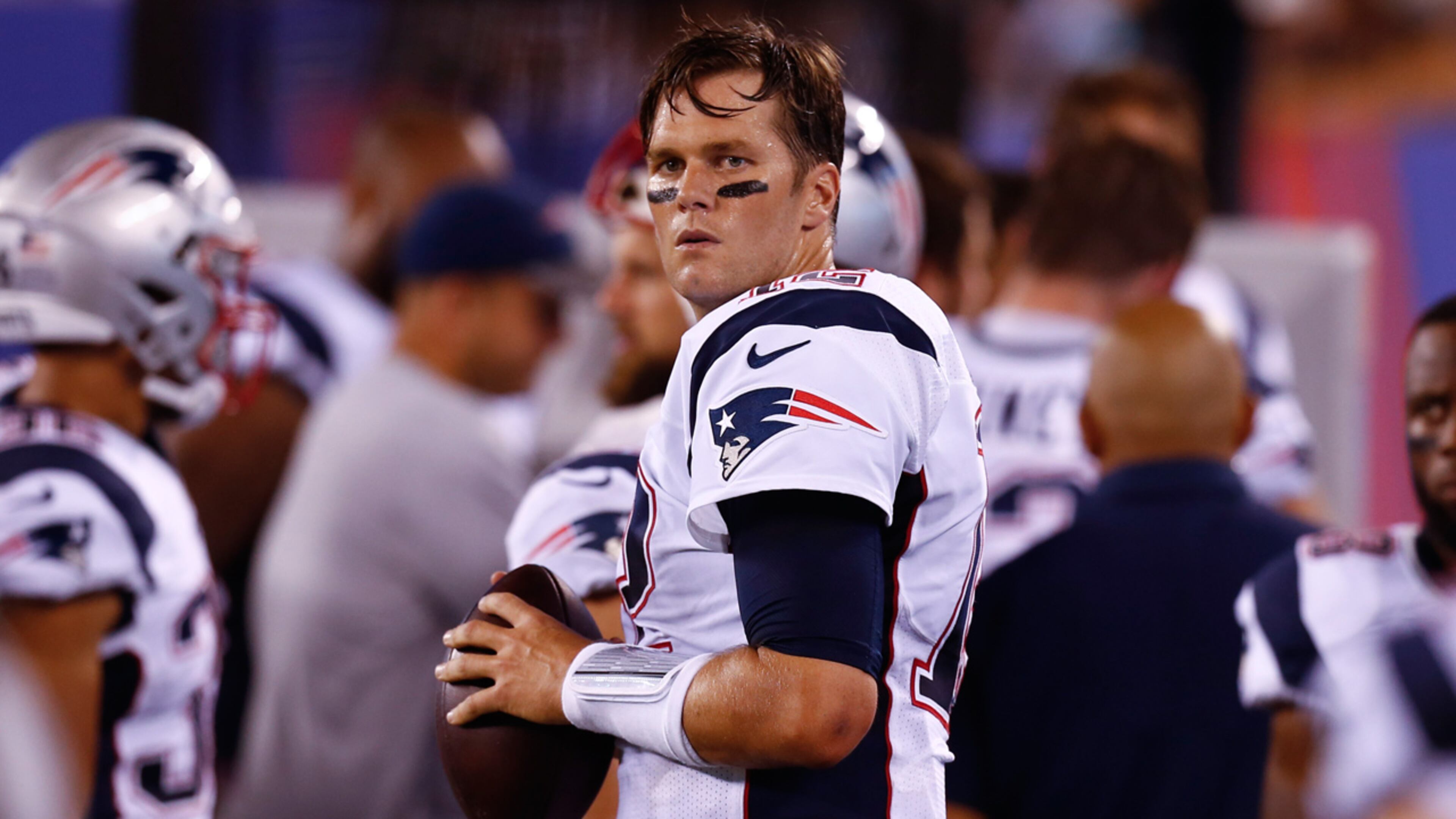 Tom Brady #12 of the New England Patriots warms up on the sidelines during their preseason game against the New York Giants at MetLife Stadium on September 1, 2016 in East Rutherford, New Jersey.