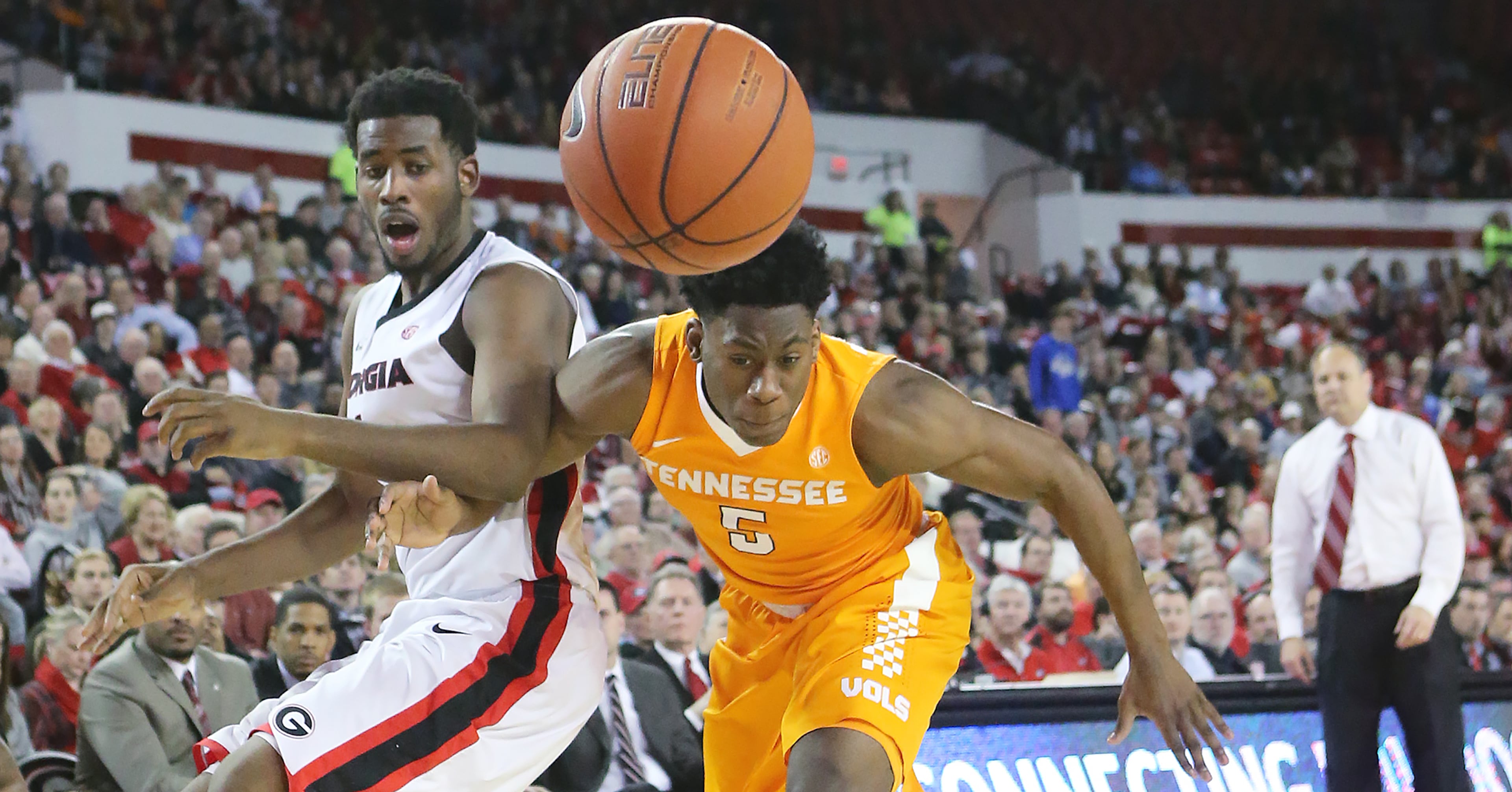 Georgia head coach Mark Fox looks on as forward Yante Maten battles Tennessee forward Admiral Schofield for the ball in a basketball game on Wednesday, Jan. 13, 2016, in Athens. Georgia beat Tennessee 81-72. Curtis Compton / ccompton@ajc.com