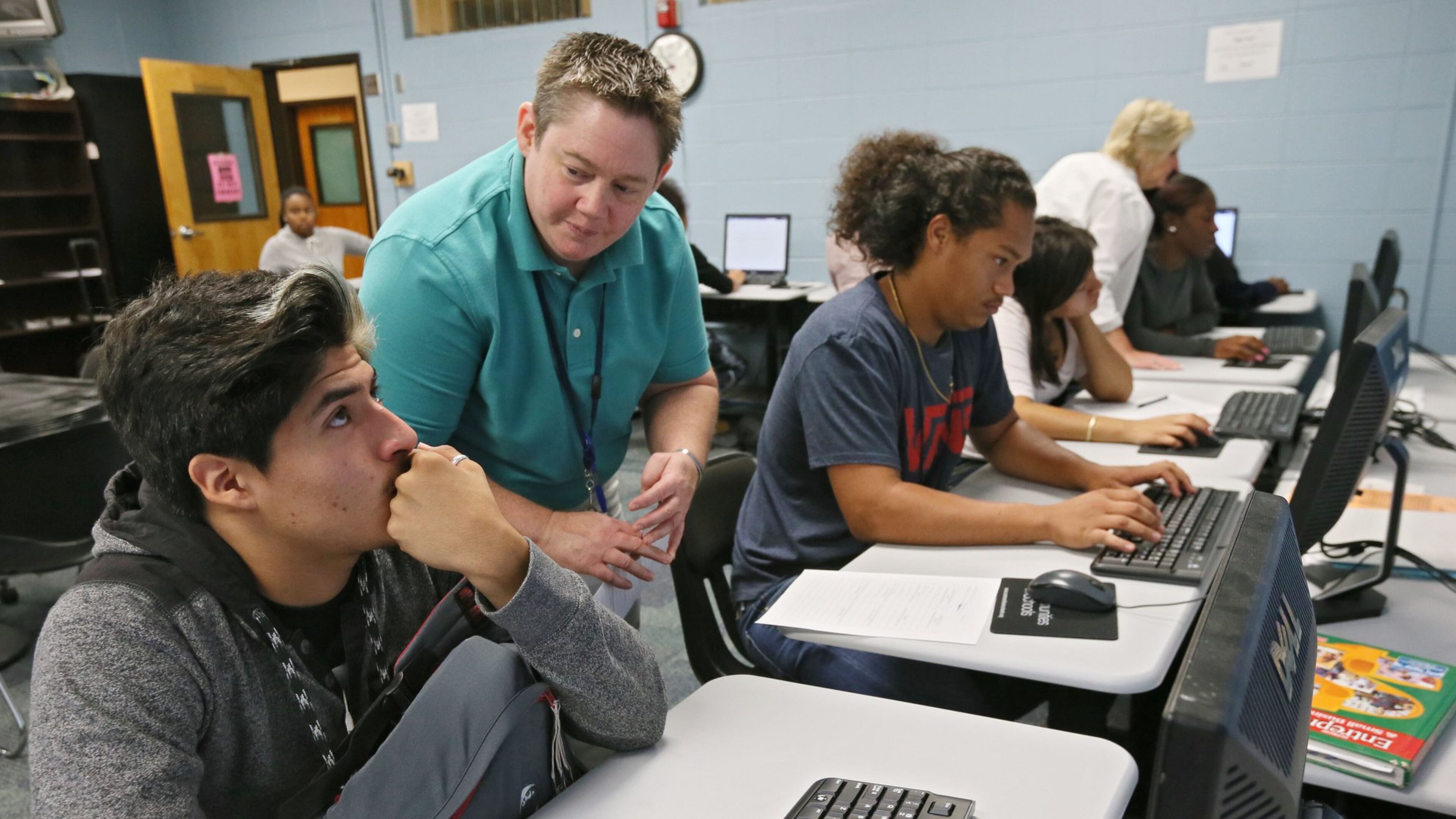 In this photo taken in September 2015, Cesar Gomez (left) gets some guidance from school counselor B.J. Smith as he works on his YouScience online assessment at the Marietta Performance Learning center. The career test was used in a pilot program at Marietta High, and now the Georgia Board of Education has approved a contract that will make it available in every high school. BOB ANDRES / BANDRES@AJC.COM