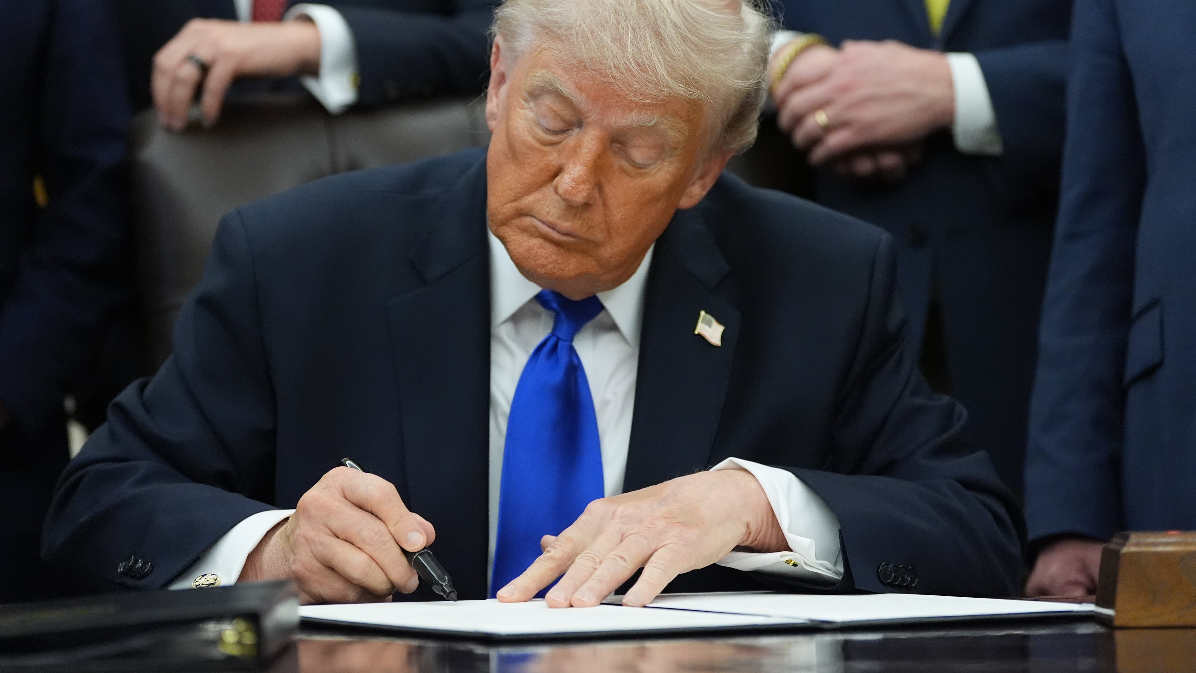 President Donald Trump signs a presidential permit regarding pipeline construction in the Oval Office of the White House, Thursday, April 30, 2026, in Washington. (AP Photo/Alex Brandon)