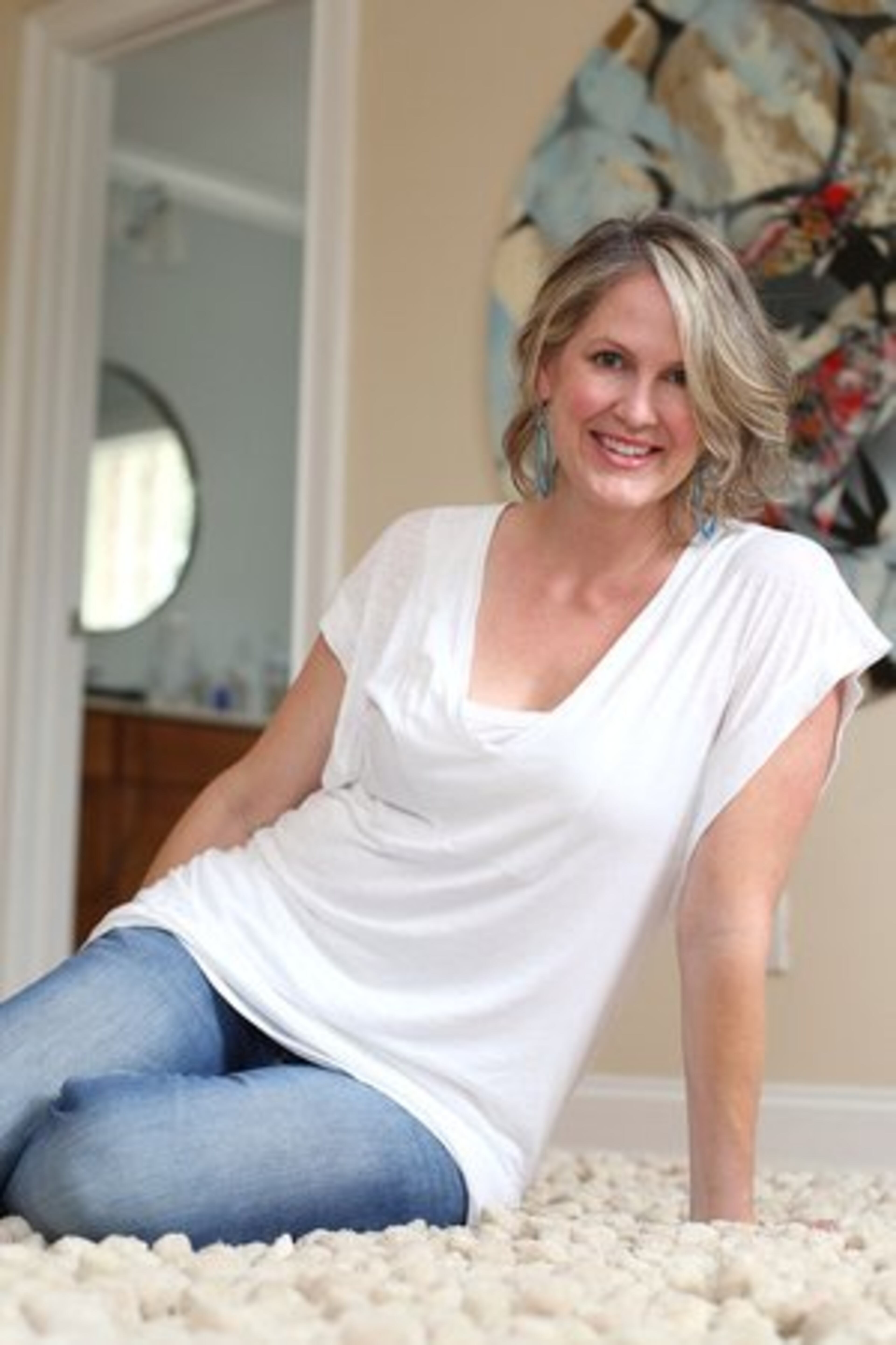 FASHION PET PEEVE: "When people buy a whole look right off a store mannequin -- no imagination, no individuality. I don't think I've ever purchased two pieces specifically to wear together." White top from Nation, H&M jeans and earrings from her Smart Glass Open Line.