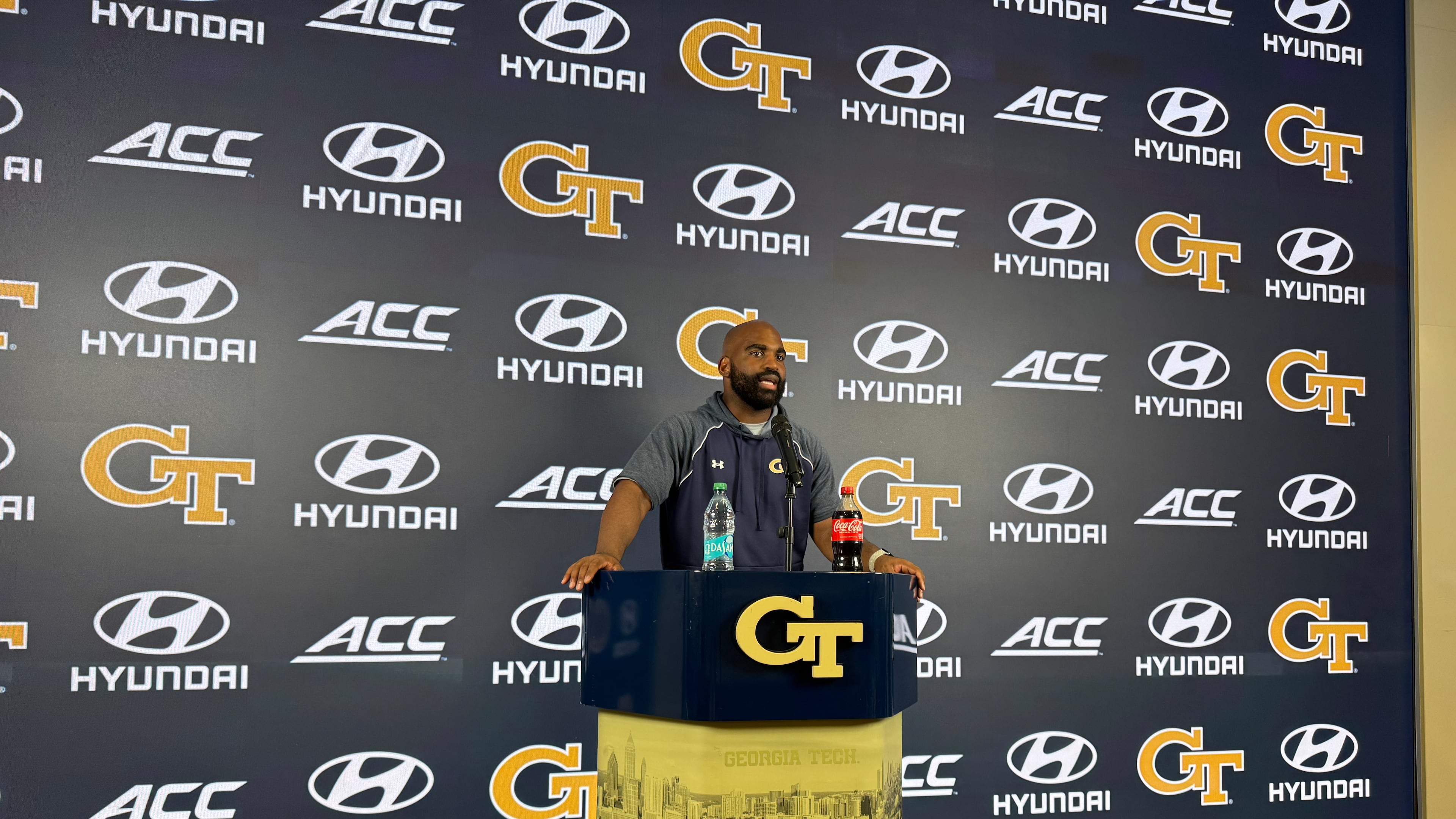 Georgia Tech defensive ends/outside linebackers coach Kyle Pope speaks during a news conference after the Yellow Jackets’ sixth practice of fall camp on Monday, Aug. 10, 2026, in Atlanta. (Fisher Isbell/AJC)