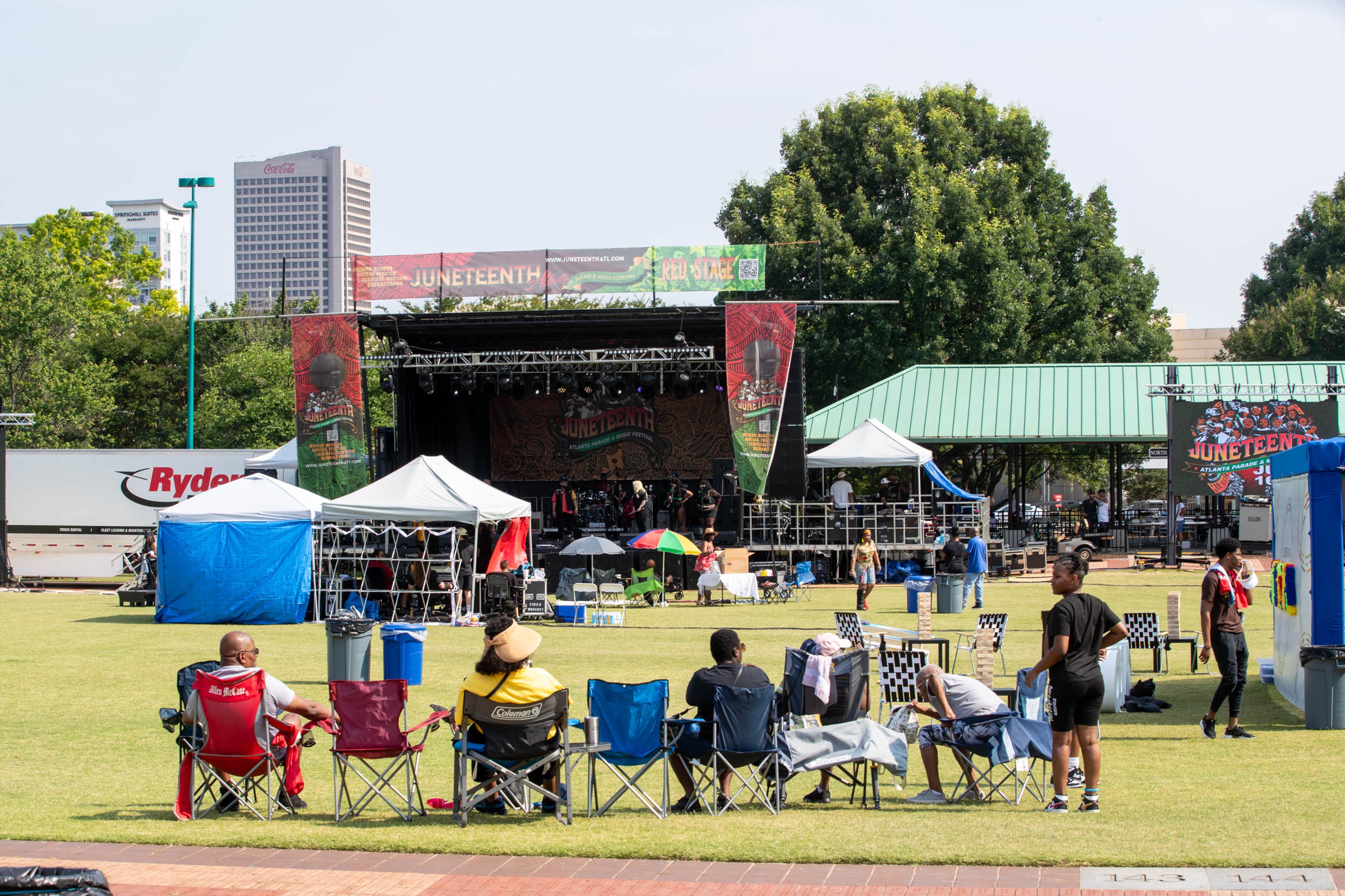 People observe and listen to music at the Juneteenth Parade and Music Festival in Atlanta on Saturday, June 17, 2023. (Katelyn Myrick/katelyn.myrick@ajc.com)