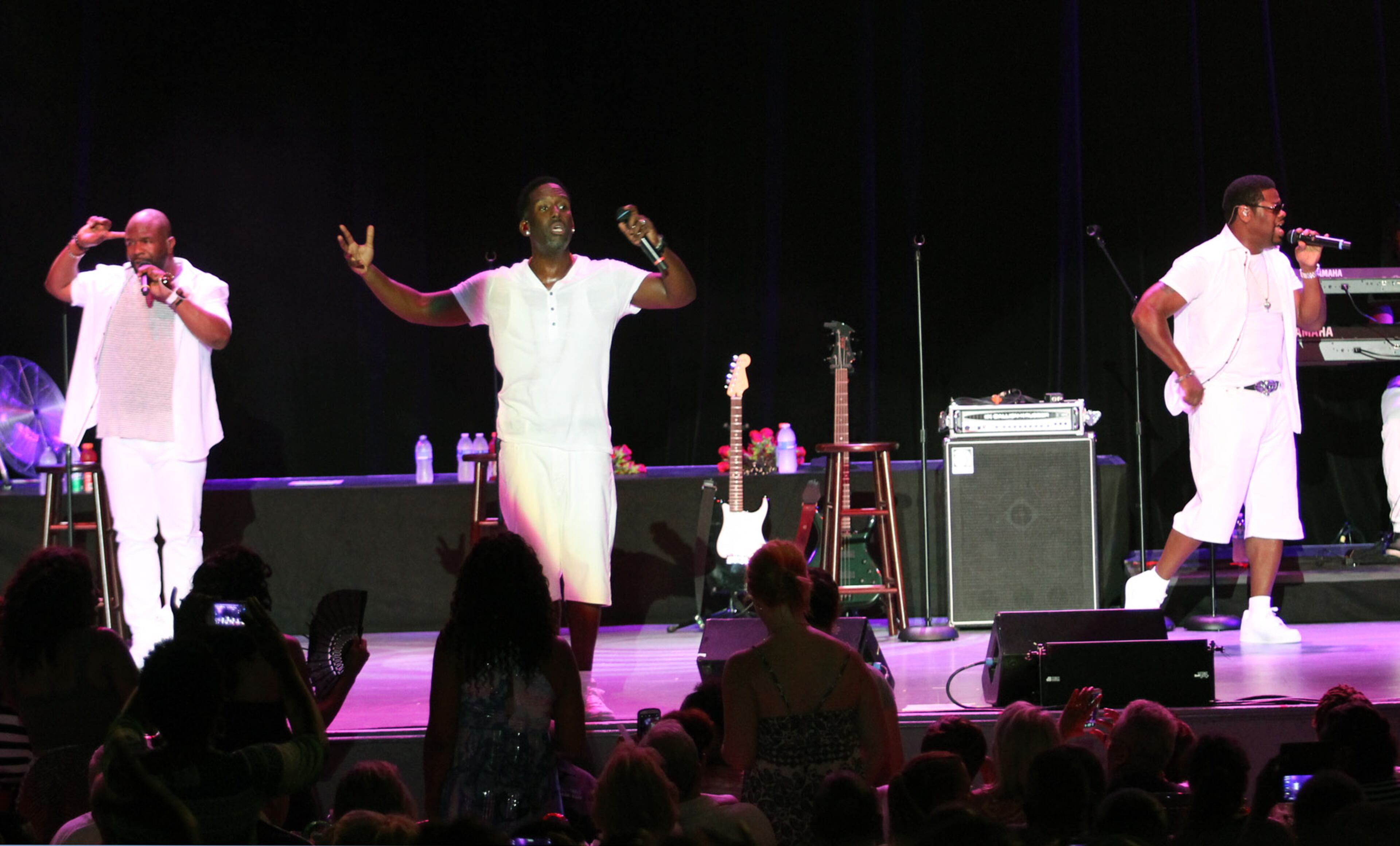 90's R&B hitmakers Boyz II Men, formerly a quartet, now a trio consisting of original members, from left, Wanya Morris, Shawn Stockman and Nathan Morris, performing at Chastain Park Amphitheatre Friday.