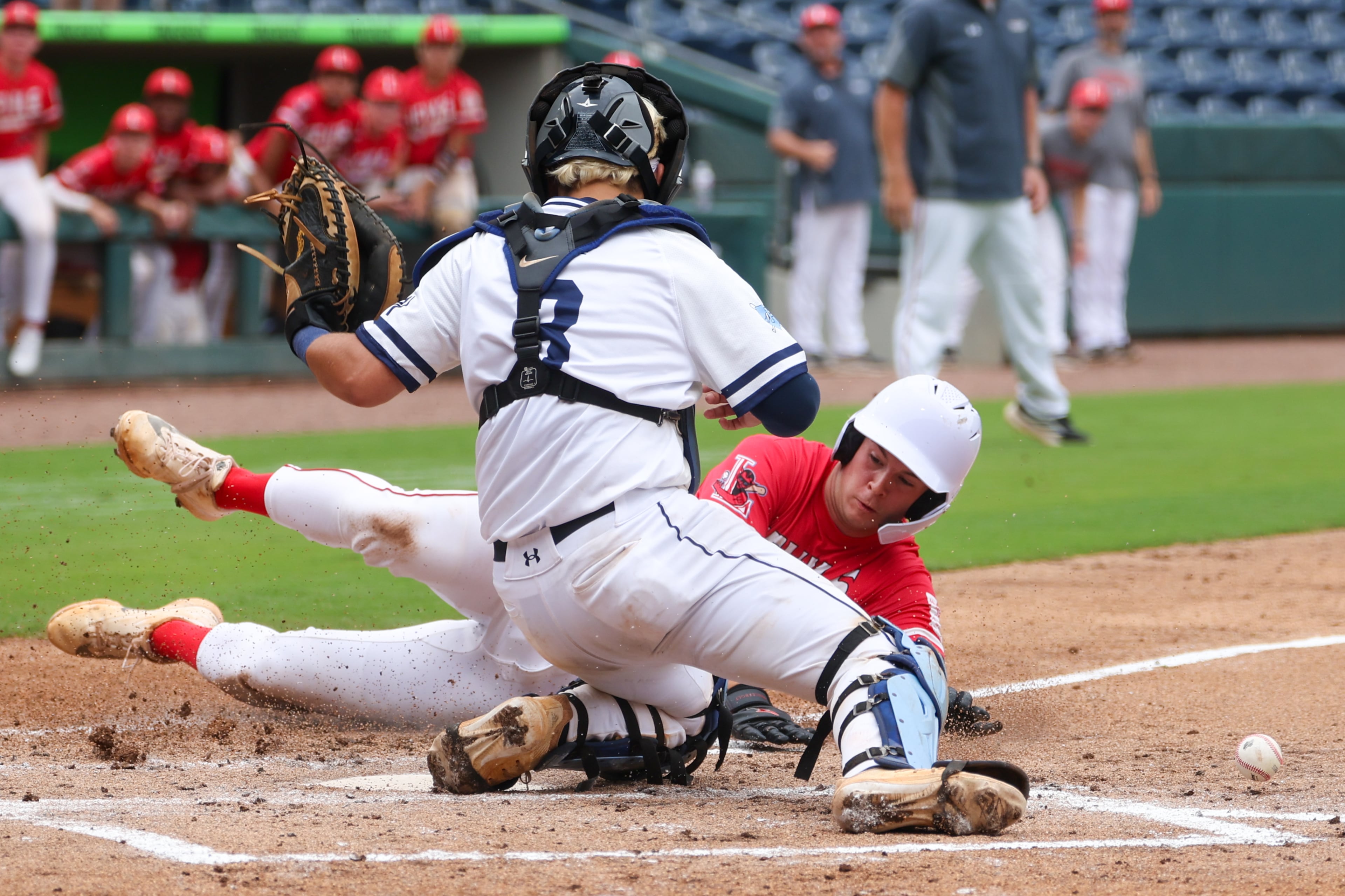 Loganville’s Caden Palmer (9) scores against Pope during Game 2 of their GHSA Class 5A baseball championship series at Gwinnett Field on Tuesday, May 26, 2026, in Lawrenceville. (Arvin Temkar/AJC)