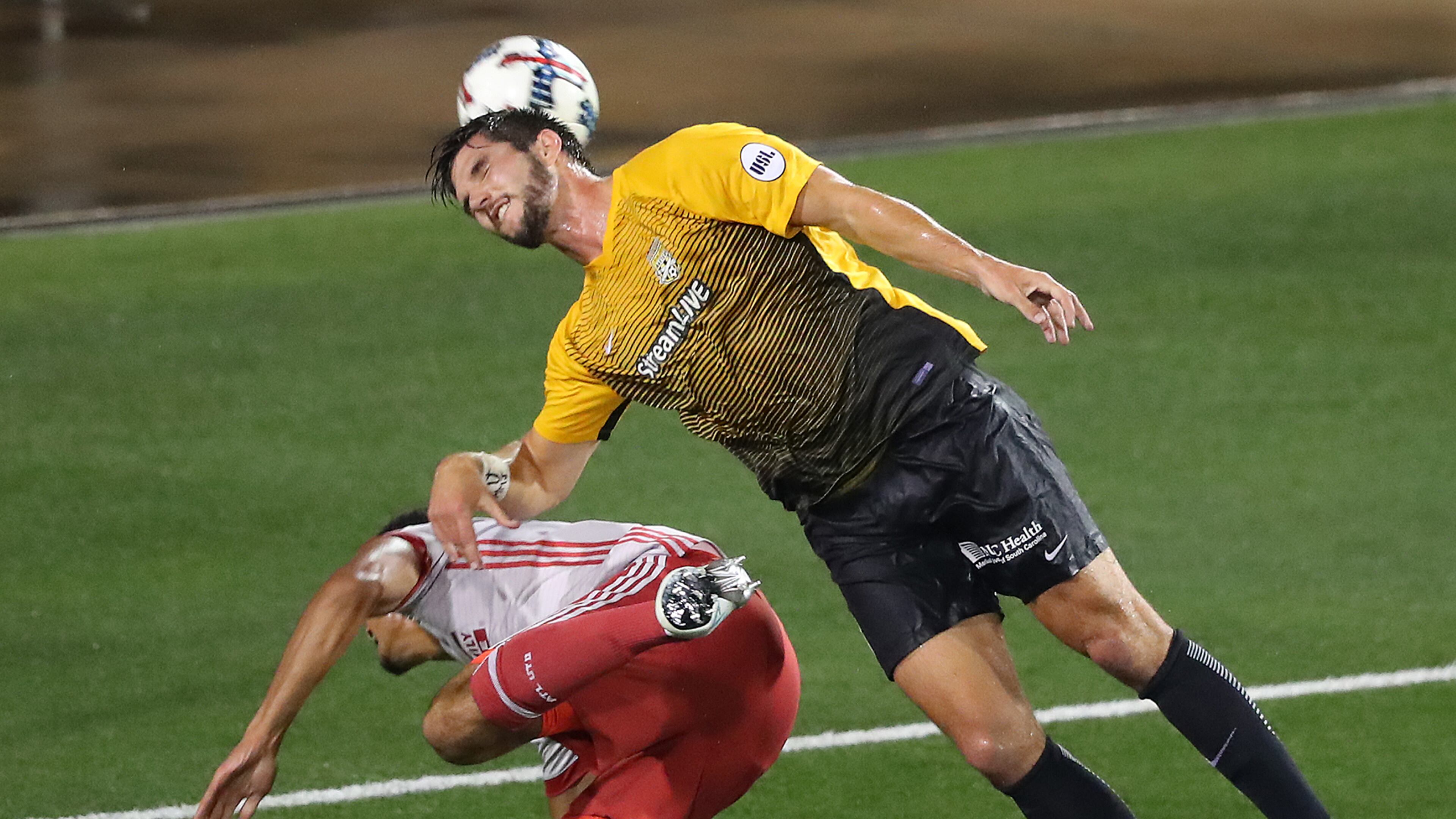 June 14, 2017, Kennesaw: Atlanta United defender Miles Robinson collides with Charleston Battery defender Rorrest Lasso in the Lamar Hunt U.S. Open Cup fourth round at 5th Third Bank Stadium on Wednesday, June 14, 2017, in Kennesaw. Curtis Compton/ccompton@ajc.com