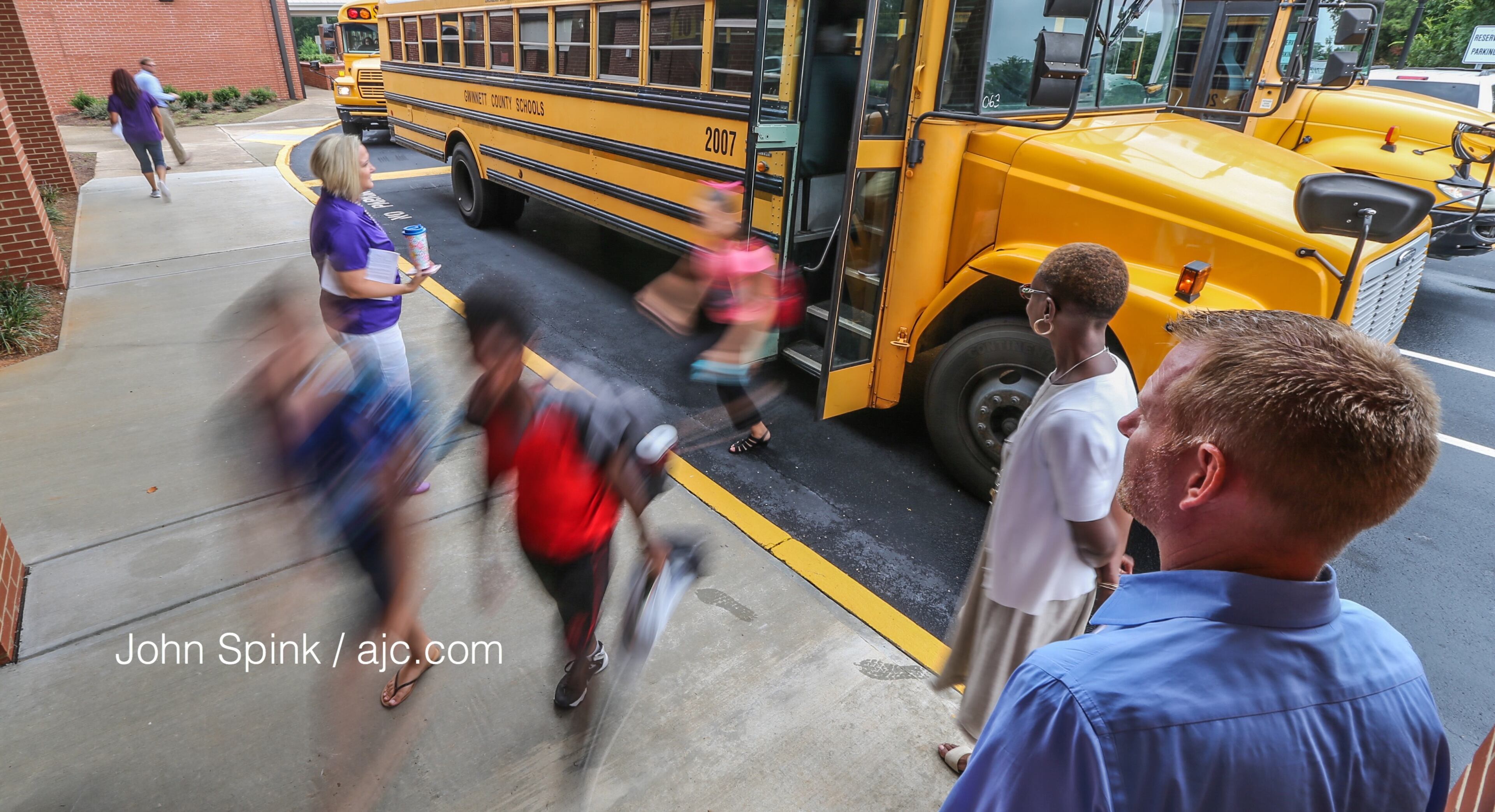 August 7, 2017 Lithonia; Fifth grade student Isaiah Brown, 10, enjoys the freedom of an open hallway as he is the first student to arrive for the first day of school at Edward L Bouie Elementary School on Monday, August 7, 2017, in Lithonia. Curtis Compton/ccompton@ajc.com