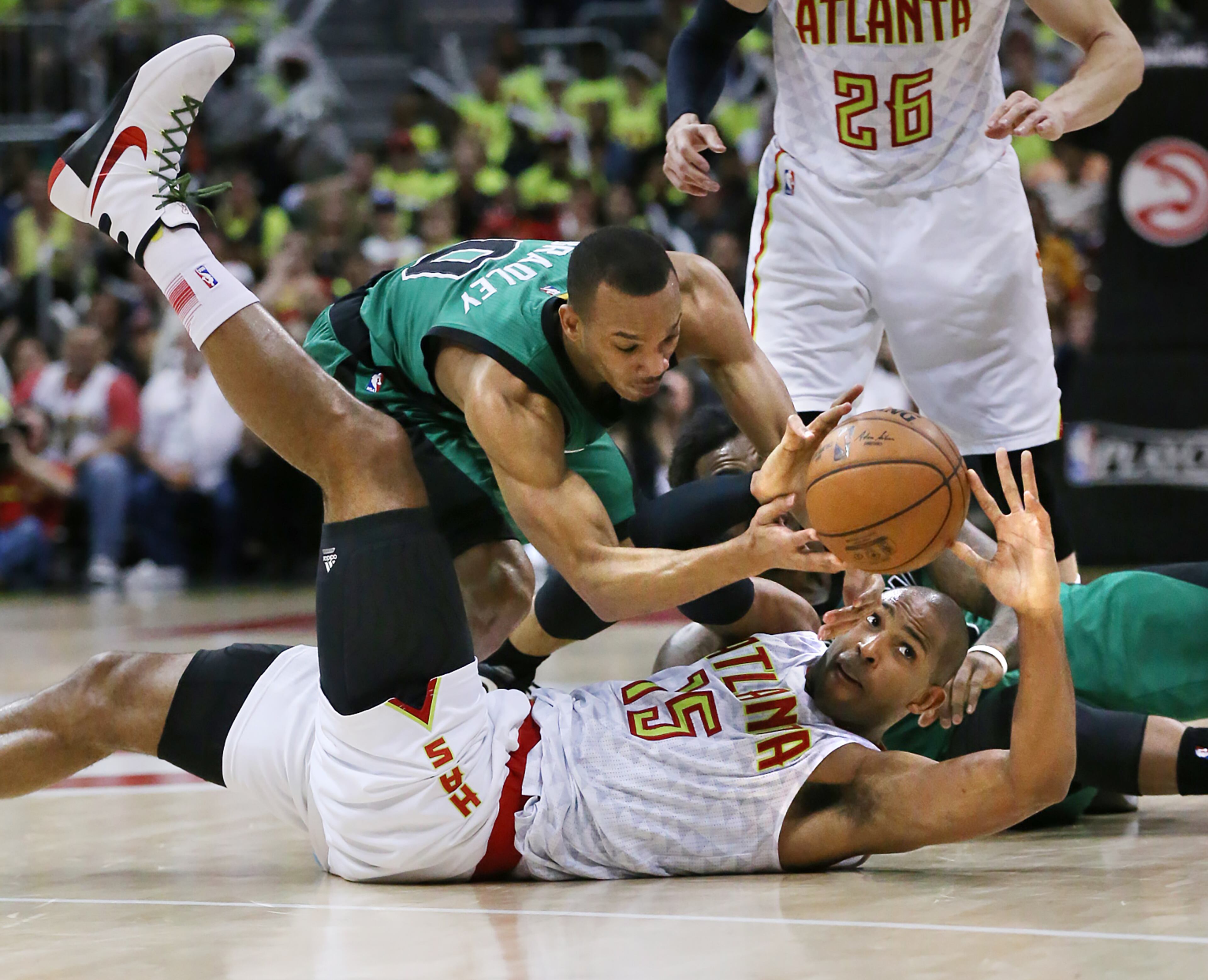 041616 ATLANTA: Hawks Al Horford and Celtics Avery Bradley battle for a loose ball in game one of their NBA Eastern Conference first round playoff game at Philips Arena on Saturday, April 16, 2016. Curtis Compton / ccompton@ajc.com