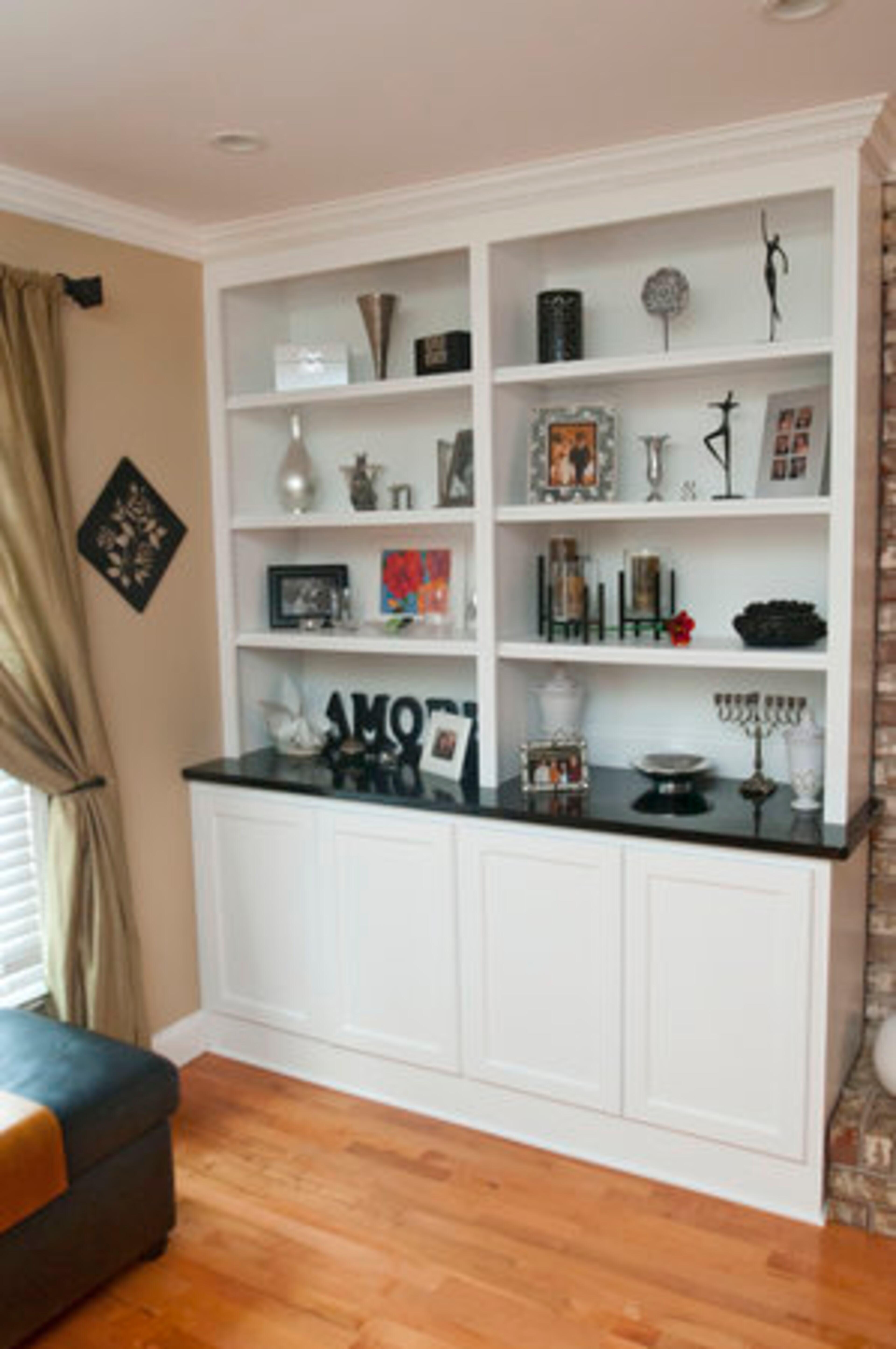The Shapiros added built-in shelving and cabinets to the sitting room, family room and theater, providing storage space and places to display family photos, decorative pieces and other personal items.