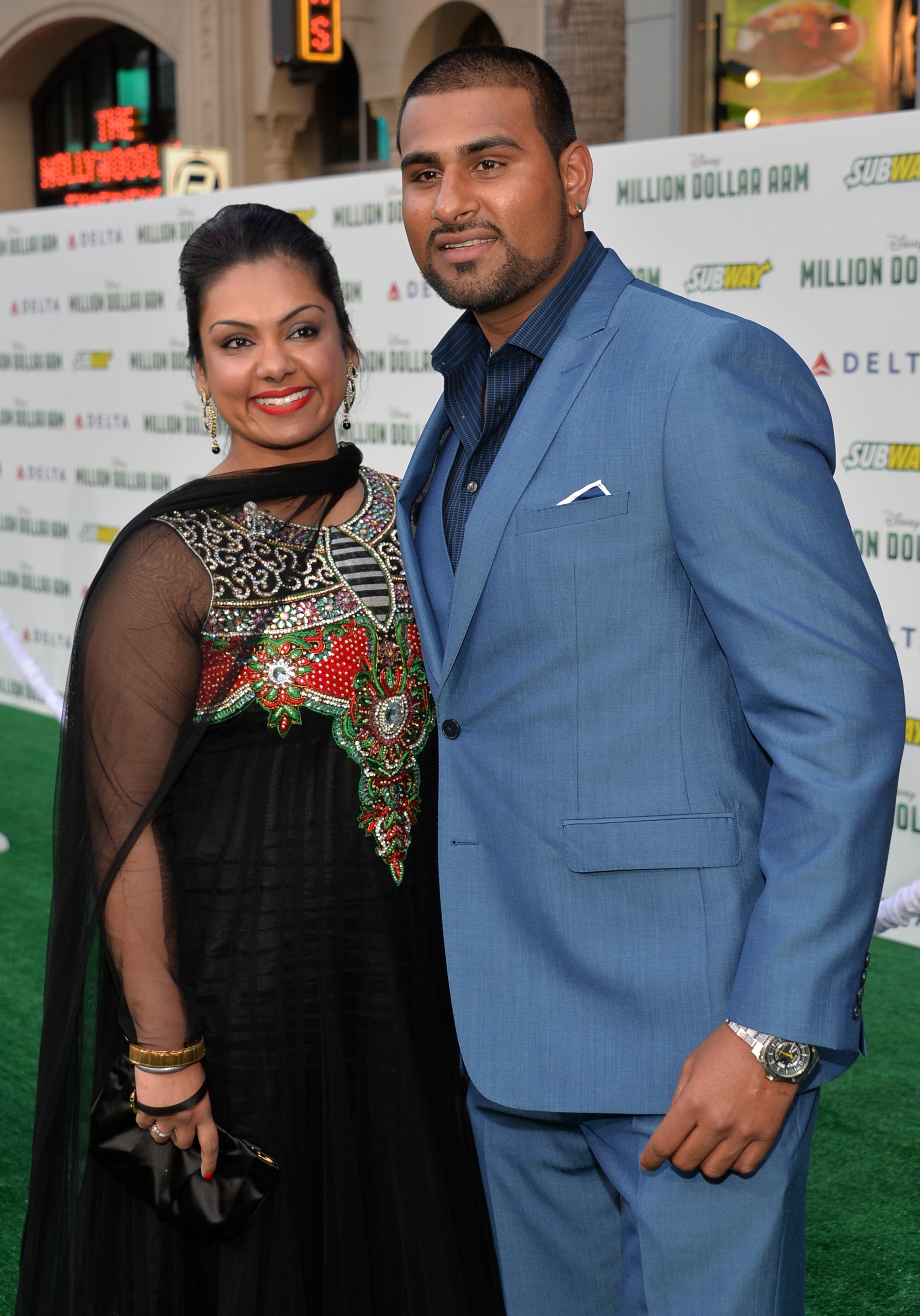 HOLLYWOOD, CA - MAY 06: Baseball player Rinku Singh (R) attends the premiere of Disney's "Million Dollar Arm" at the El Capitan Theatre on May 6, 2014 in Hollywood, California. (Photo by Alberto E. Rodriguez/Getty Images)