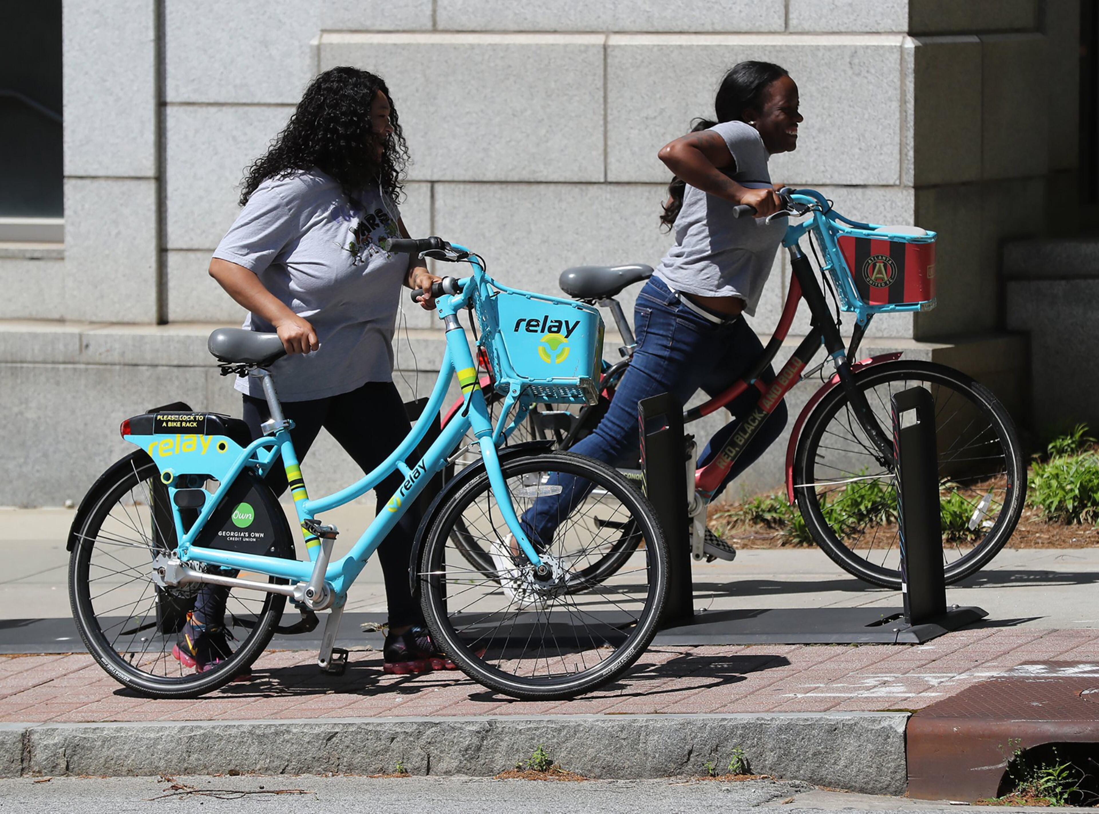 April 9, 2020 Atlanta: With the absence of scooters in the city Tarian Davis (right) and Nita Smith settle on a pair of the last remaining e-bikes at the Marta Midtown Transit Station on Tenth Street on Thursday, April 9, 2020, in Atlanta. For the past year, Atlanta residents and city leaders have complained about scooters lying in sidewalks and roadways leading to increased safety concerns for pedestrians and wheelchair users. Despite Atlanta’s efforts to manage the problem, it seems all it took was widespread virus. Curtis Compton ccompton@ajc.com
