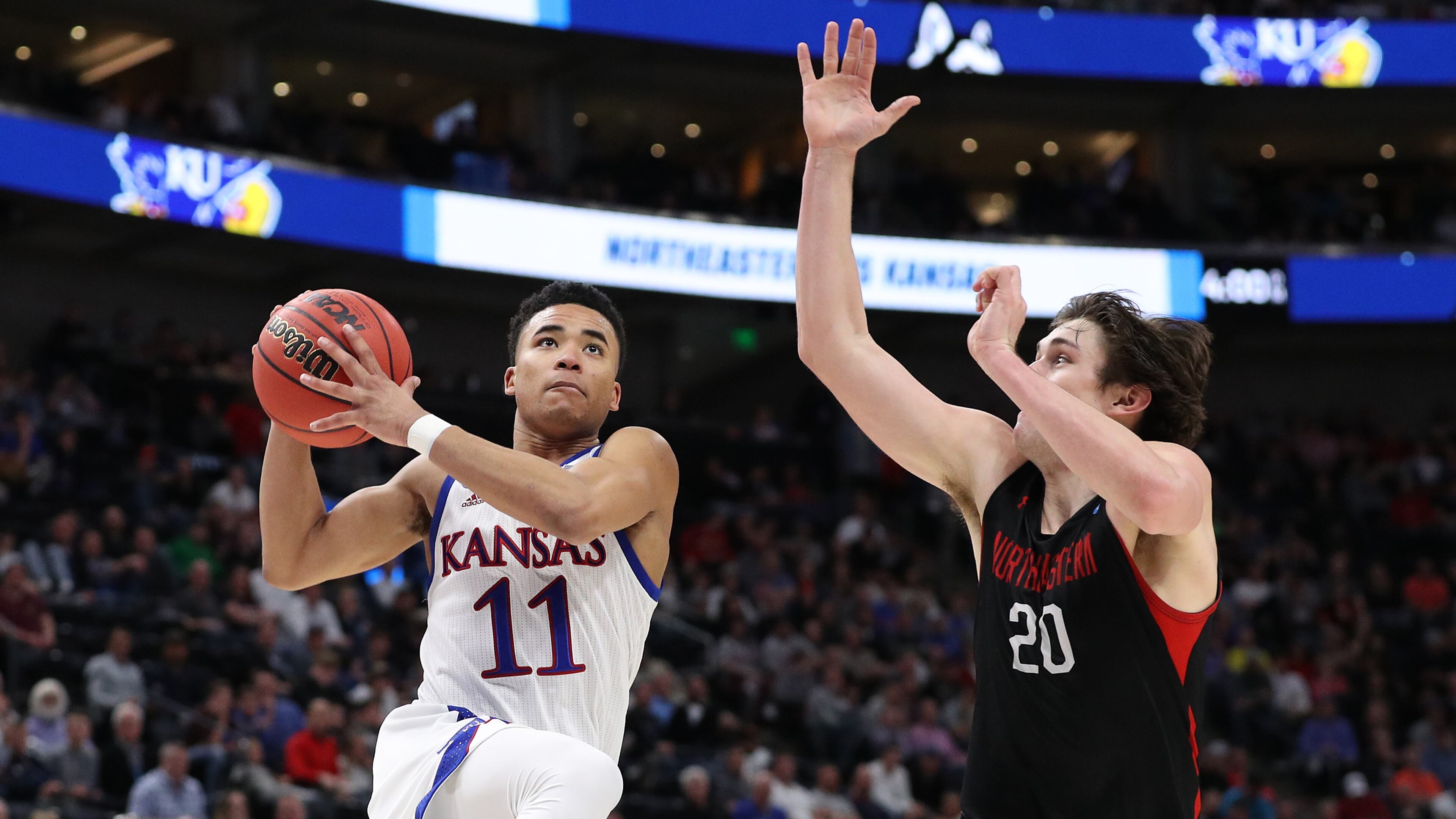 Devon Dotson of the Kansas Jayhawks drives to the basket against Bolden Brace of the Northeastern Huskies during the second half in the first round of the 2019 NCAA Men's Basketball Tournament at Vivint Smart Home Arena on March 21, 2019 in Salt Lake City, Utah. (Photo by Patrick Smith/Getty Images)