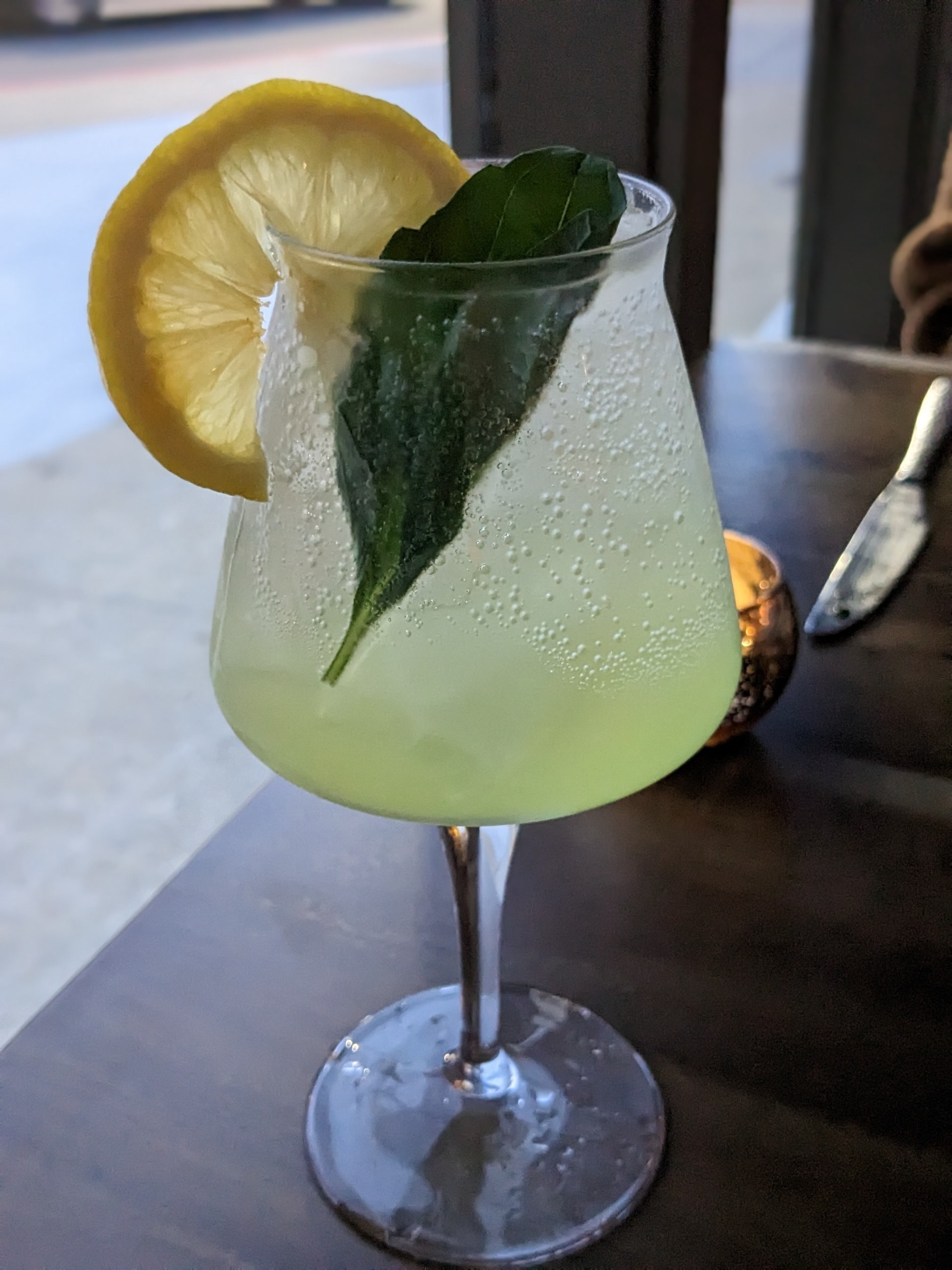 The combination of lemon, limoncello, basil, sparkling wine and soda makes the spiteful monk a refreshing spritz. Courtesy of Paula Pontes