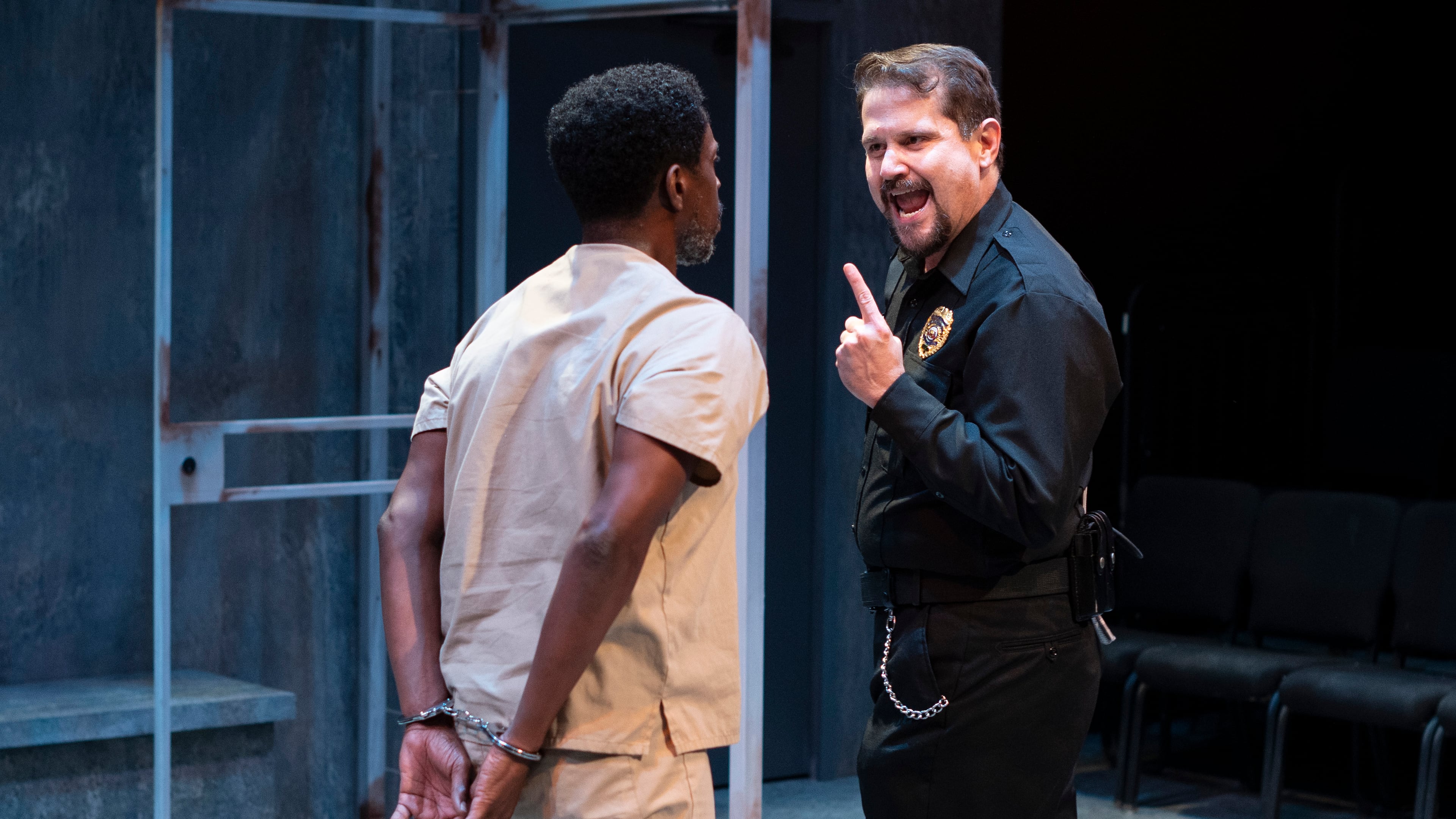 A prison guard (Luis Hernandez) screams at Lucius (Sekou Laidlow). Photo: Greg Mooney