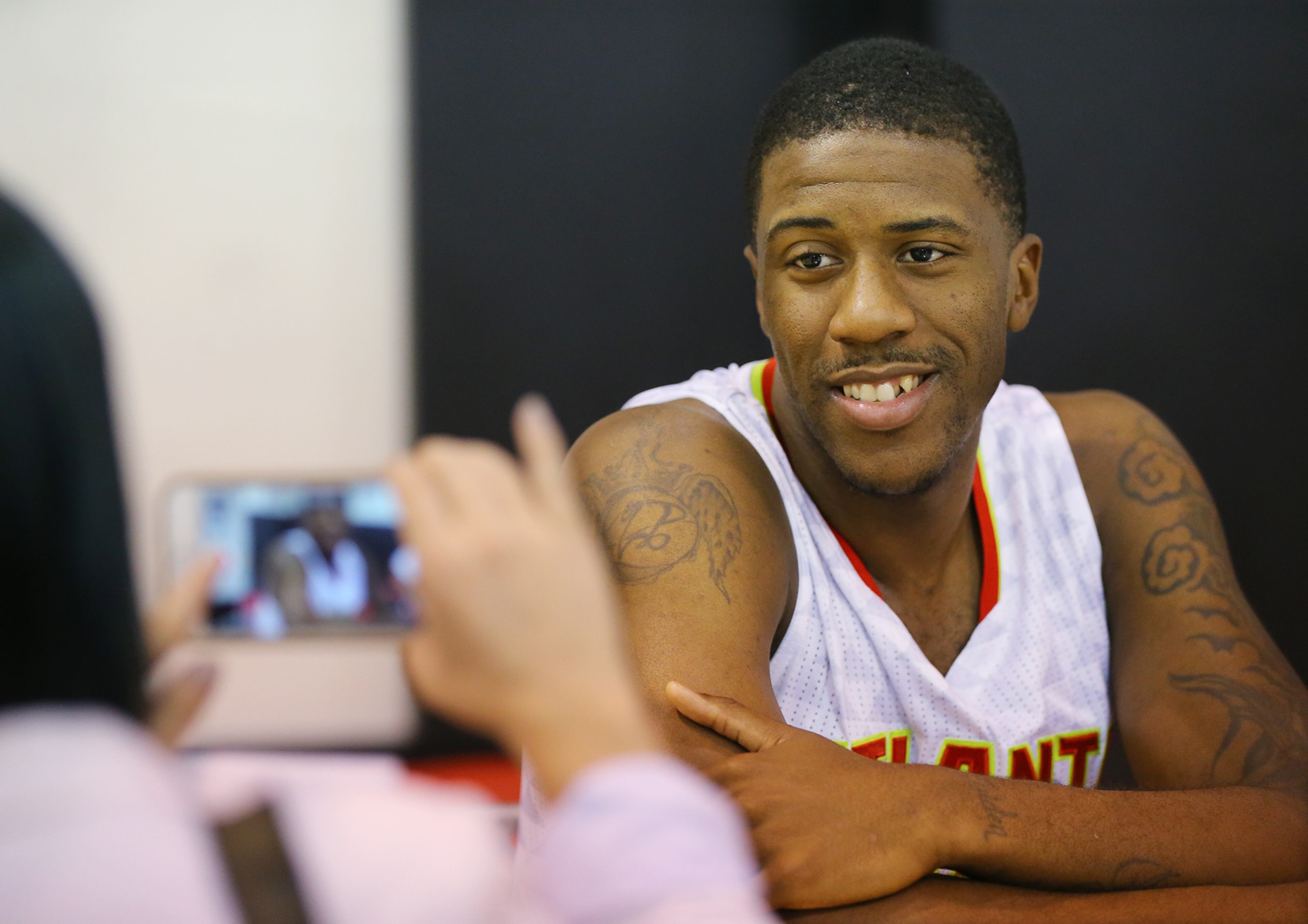 Hawks guard Lamar Patterson is all smiles during an intervie on the team's annual Media Day at the Philips Arena Practice Court on Monday, Sept. 28, 2015, in Atlanta.