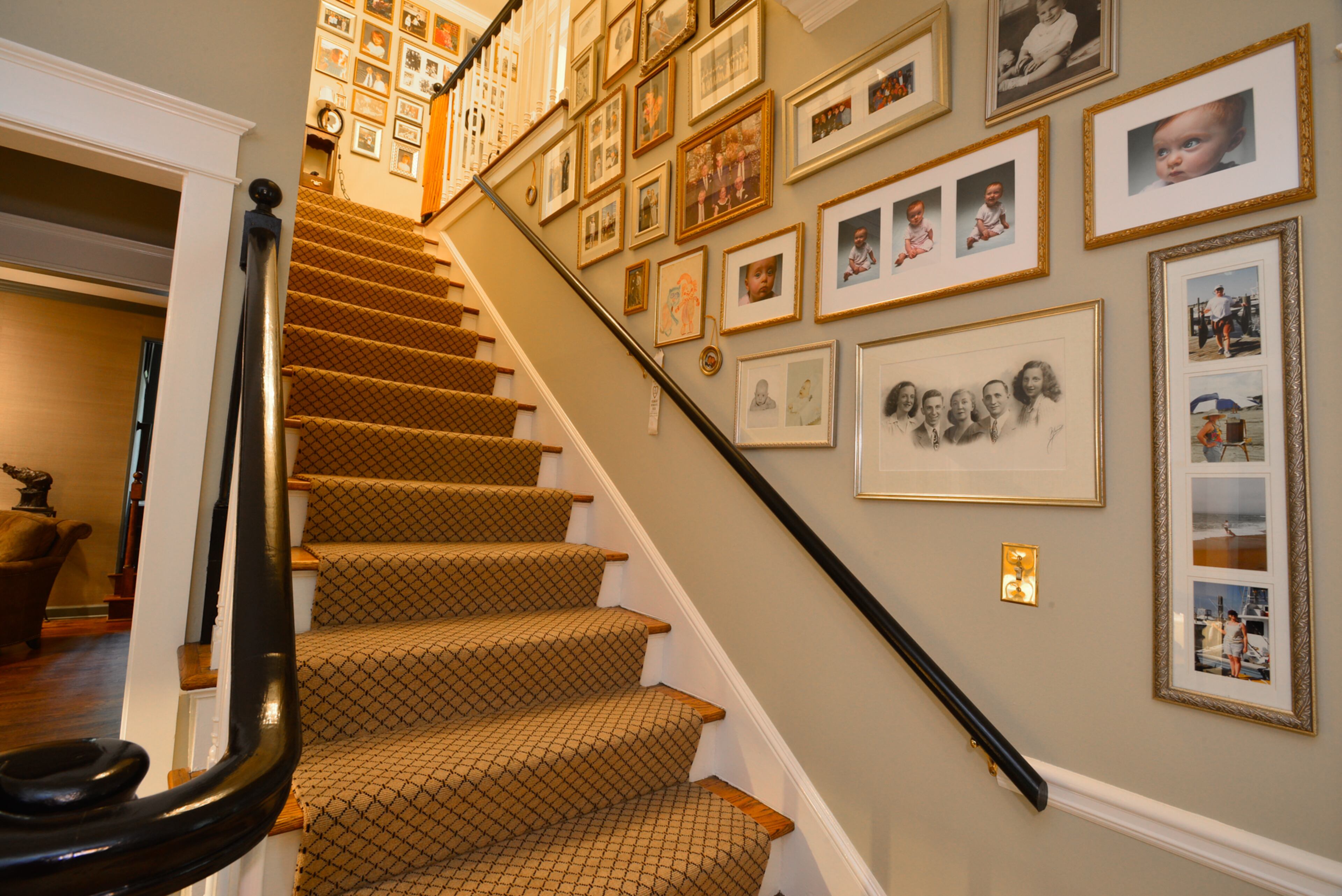 Having the stairwell filled with family photos connects Lisa Gleim-Jonas to her childhood. Her grandmother took beautiful pictures and surrounded herself with them, including from the floor to ceiling in the den, said Gleim-Jonas, owner of Lisa Gleim Fine Art Portraits.