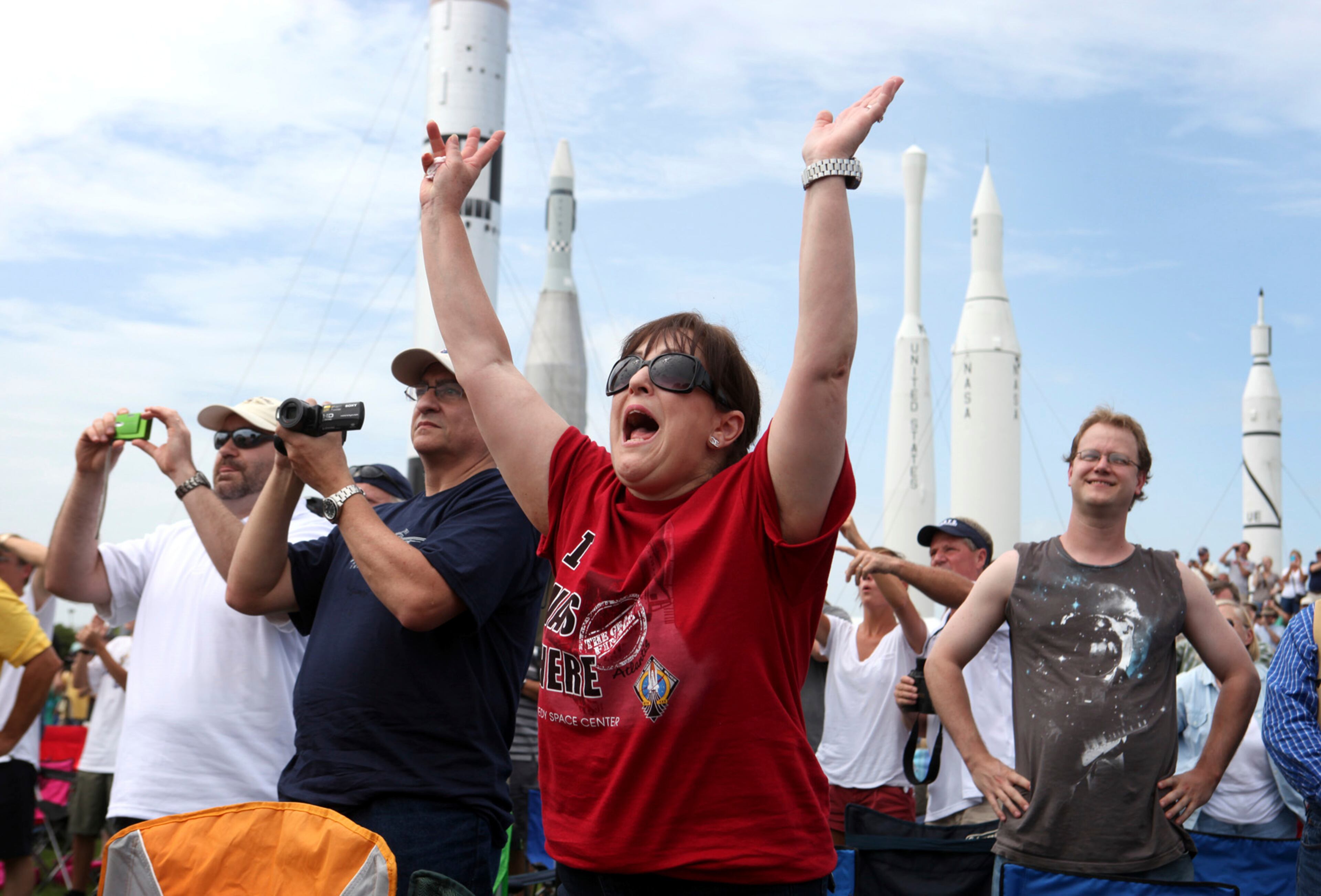 Vanessa Fabrega of Austin, Texas, cheered the 135th and final shuttle launch for the U.S.
