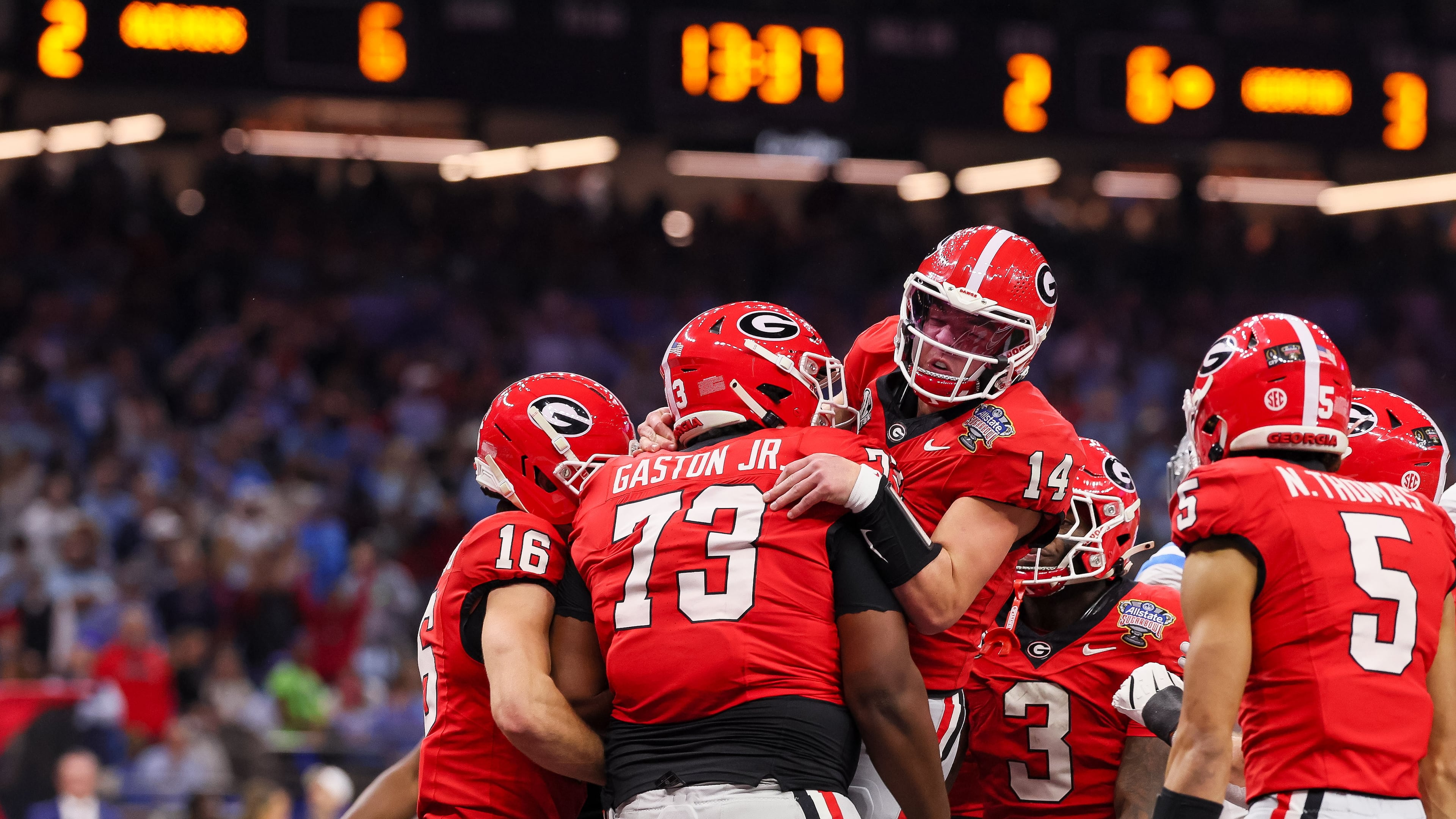 Georgia Bulldogs quarterback Gunner Stockton celebrates a 12-yard touchdown run against the Ole Miss Rebels during the second quarter of the NCAA College Football Playoff quarterfinal game at the Sugar Bowl in the Caesars Superdome, Thursday, Jan. 1, 2026, in New Orleans. (Jason Getz/AJC)