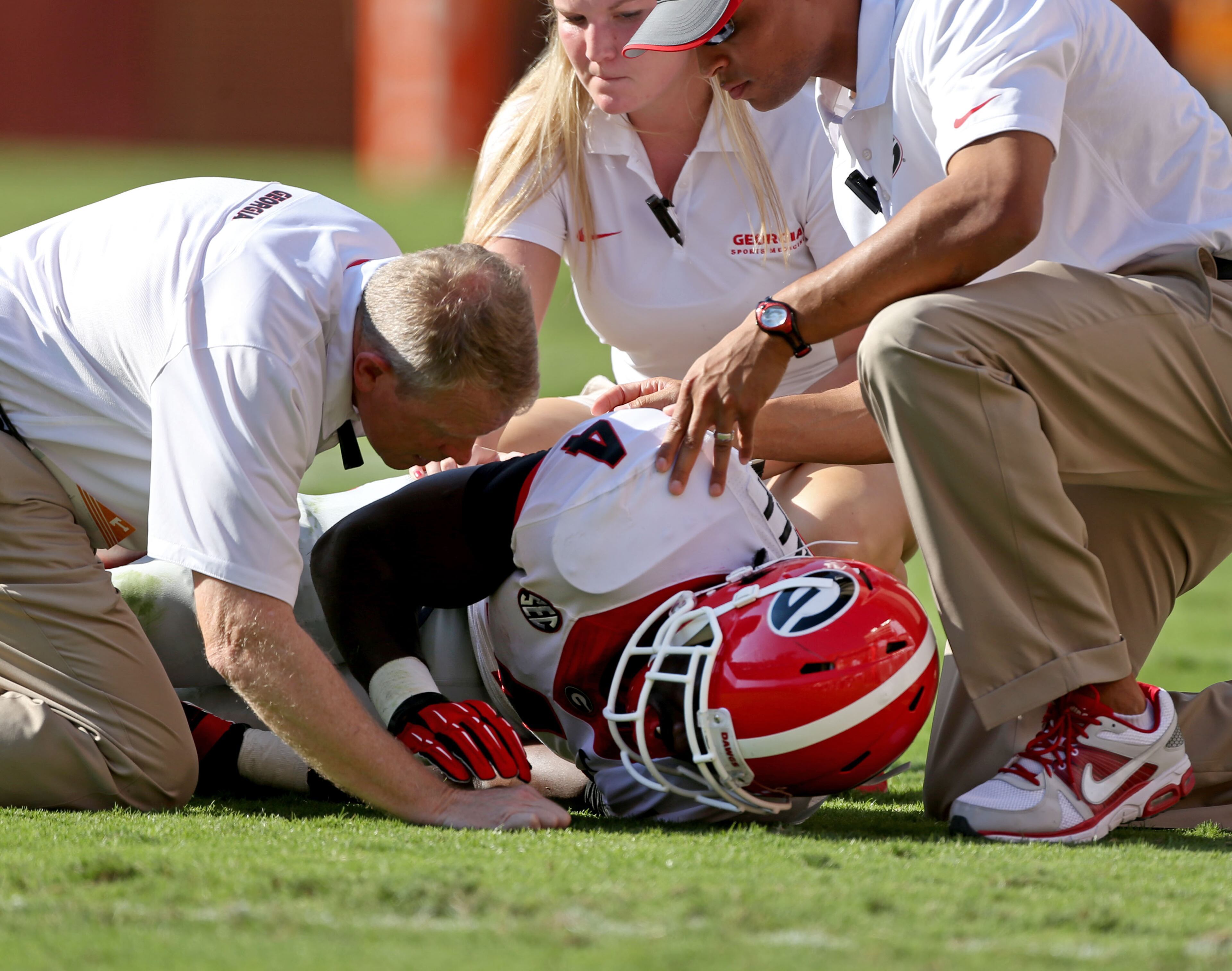 Georgia Bulldogs running back Keith Marshall (4) is looked at by trainers after he was injured in the first half of their game against University of Tennessee at Neyland Stadium Saturday afternoon in Knoxville, Tn., October 5, 2013.