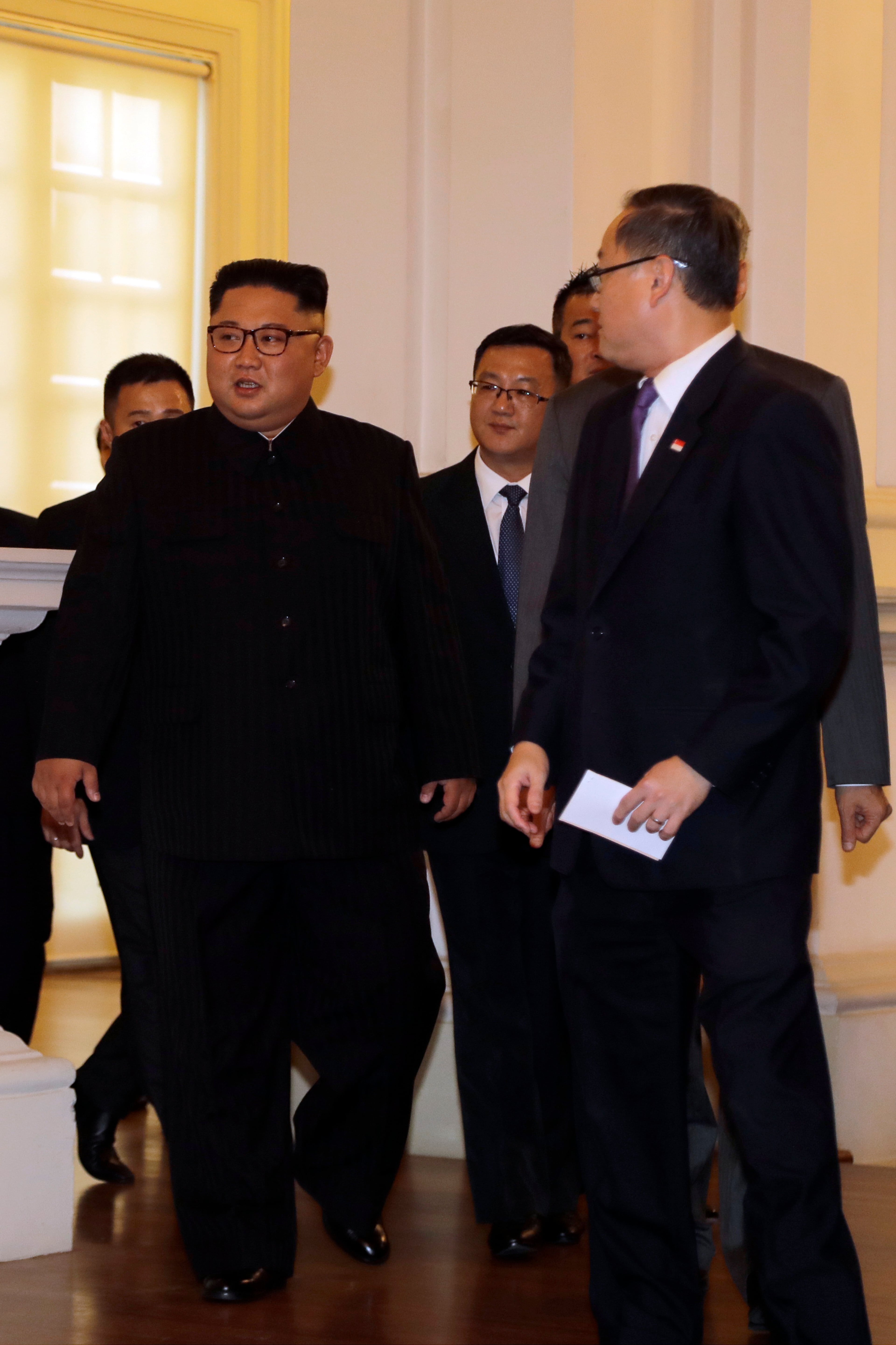 North Korean leader Kim Jong Un meets with Singapore's Prime Minister Lee Hsien Loong at the Istana or presidential palace on Sunday, June 10, 2018, in Singapore. (AP Photo/Wong Maye-E)