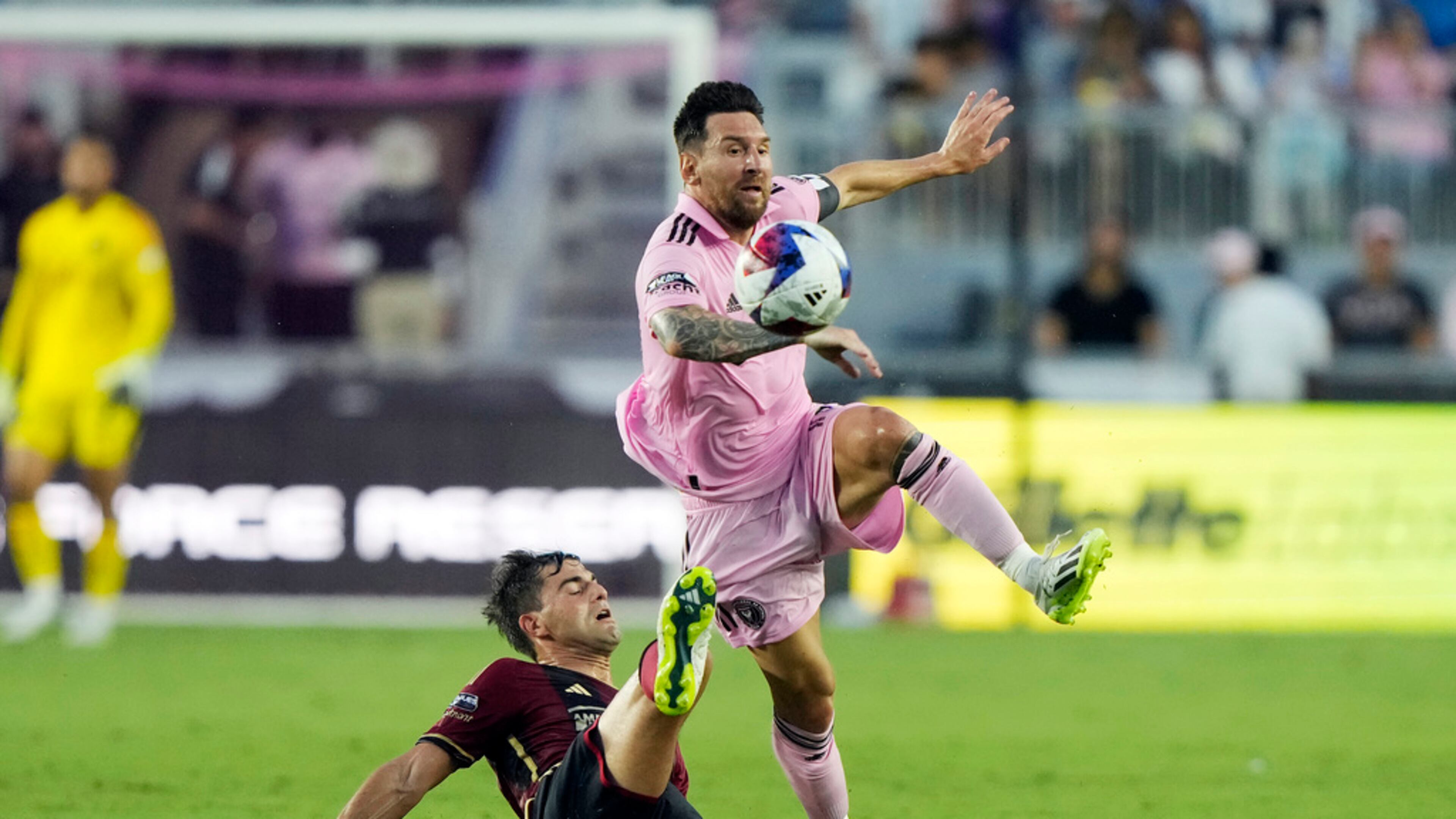 Atlanta United midfielder Santiago Sosa (5) defends against Inter Miami forward Lionel Messi (10) during the first half of a Leagues Cup soccer match, Tuesday, July 25, 2023, in Fort Lauderdale, Fla. (AP Photo/Lynne Sladky)
