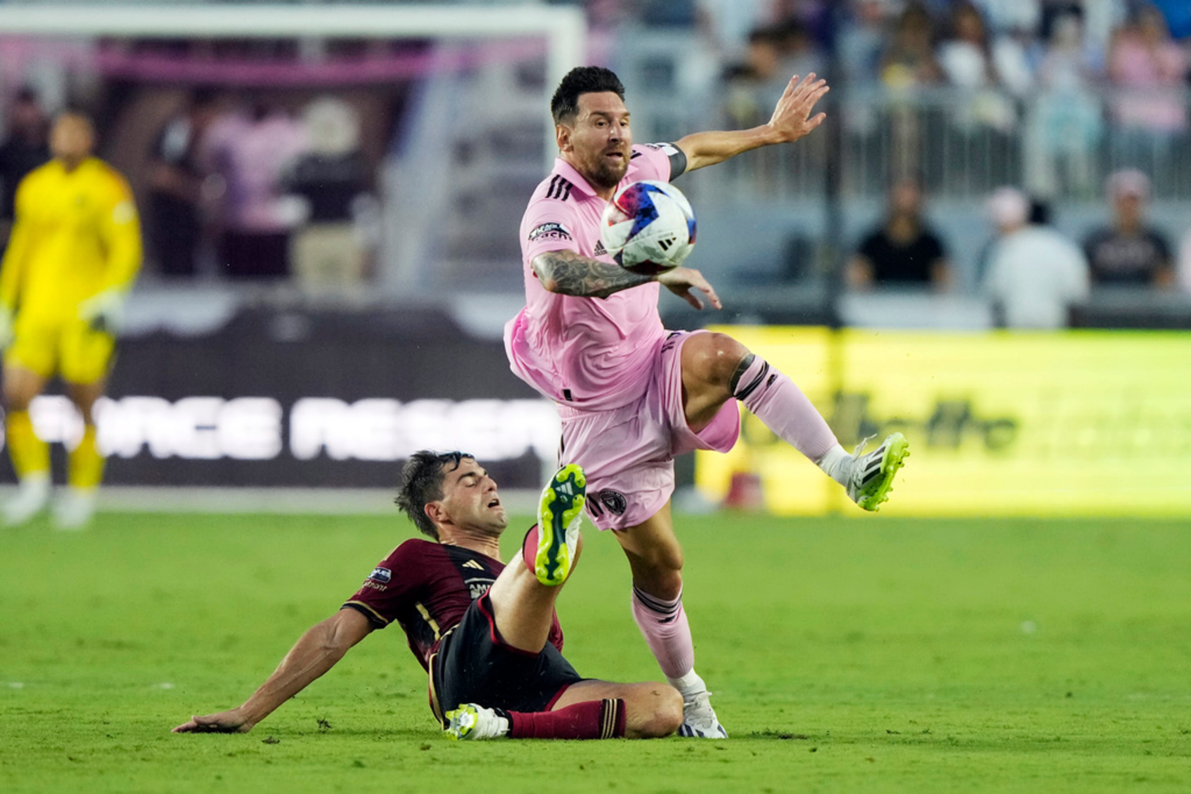 Atlanta United midfielder Santiago Sosa (5) defends against Inter Miami forward Lionel Messi (10) during the first half of a Leagues Cup soccer match, Tuesday, July 25, 2023, in Fort Lauderdale, Fla. (AP Photo/Lynne Sladky)