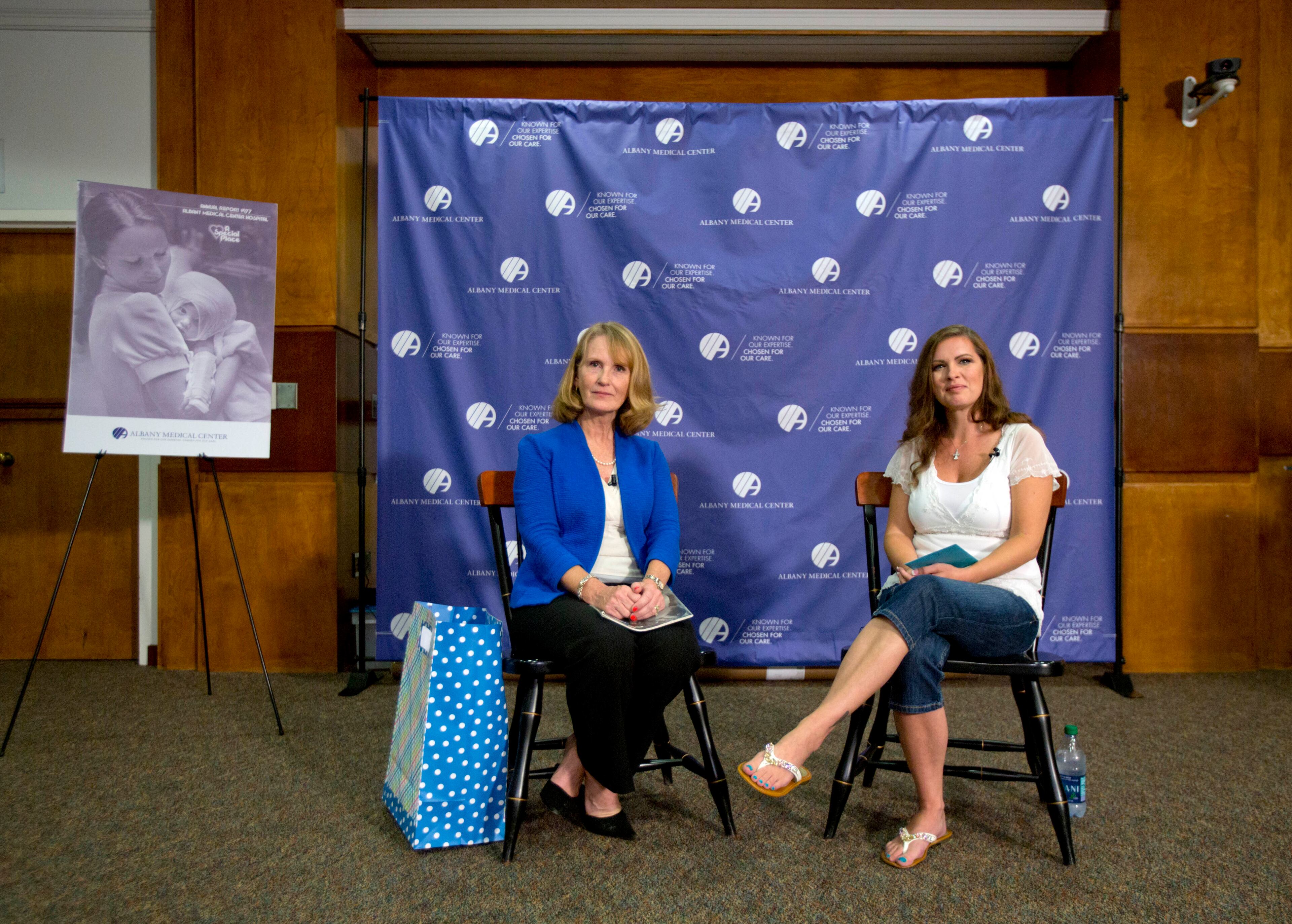 Nurse Susan Berger, left, and Amanda Scarpinati answer questions during a news conference at Albany Medical Center on Sept. 29, 2015, in Albany, N.Y. Scarpinati, who suffered severe burns as an infant, is finally getting the chance to thank Berger who cared for her, thanks to a social media posting that revealed the identity of the nurse in 38-year-old photos.