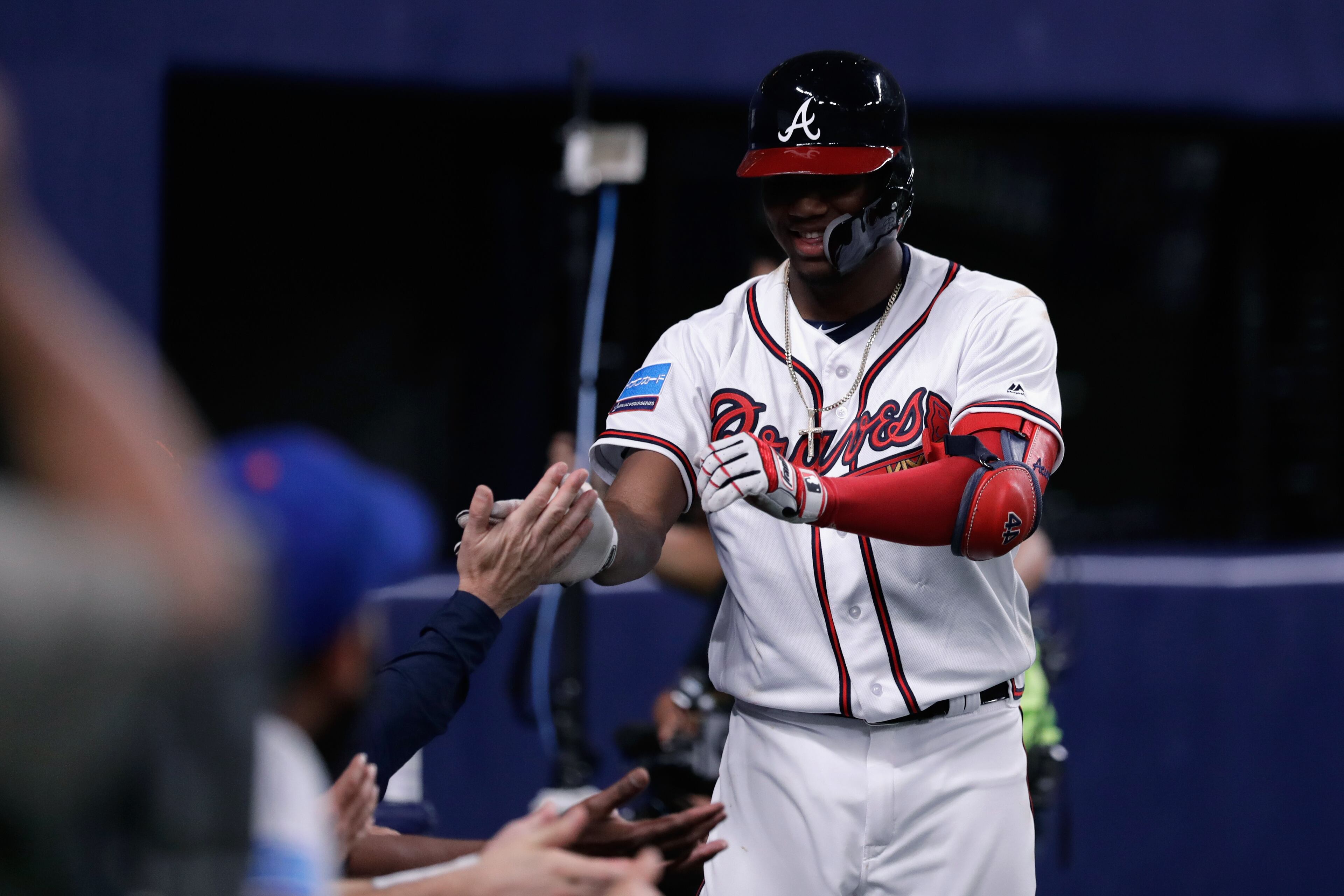 NAGOYA, JAPAN - NOVEMBER 15: Outfielder Ronald Acuna Jr. #13 of the Atlanta Braves celebrates after hitting a solo home run in the bottom of 8th inning during the game six between Japan and MLB All Stars at Nagoya Dome on November 15, 2018 in Nagoya, Aichi, Japan. (Photo by Kiyoshi Ota/Getty Images)