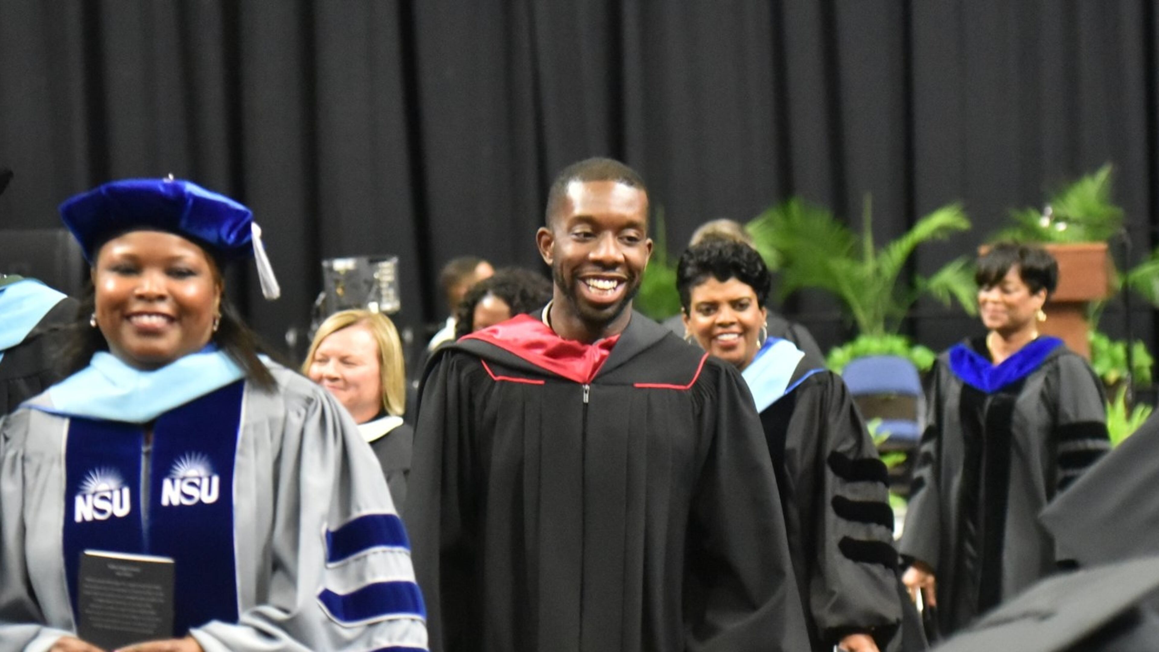 Everton Blair (center) attended Shiloh High School's 2019 graduation ceremony. Blair is a graduate of the school and recently completed a term on the Gwinnett school board. (Hyosub Shin / Hyosub.Shin@ajc.com)