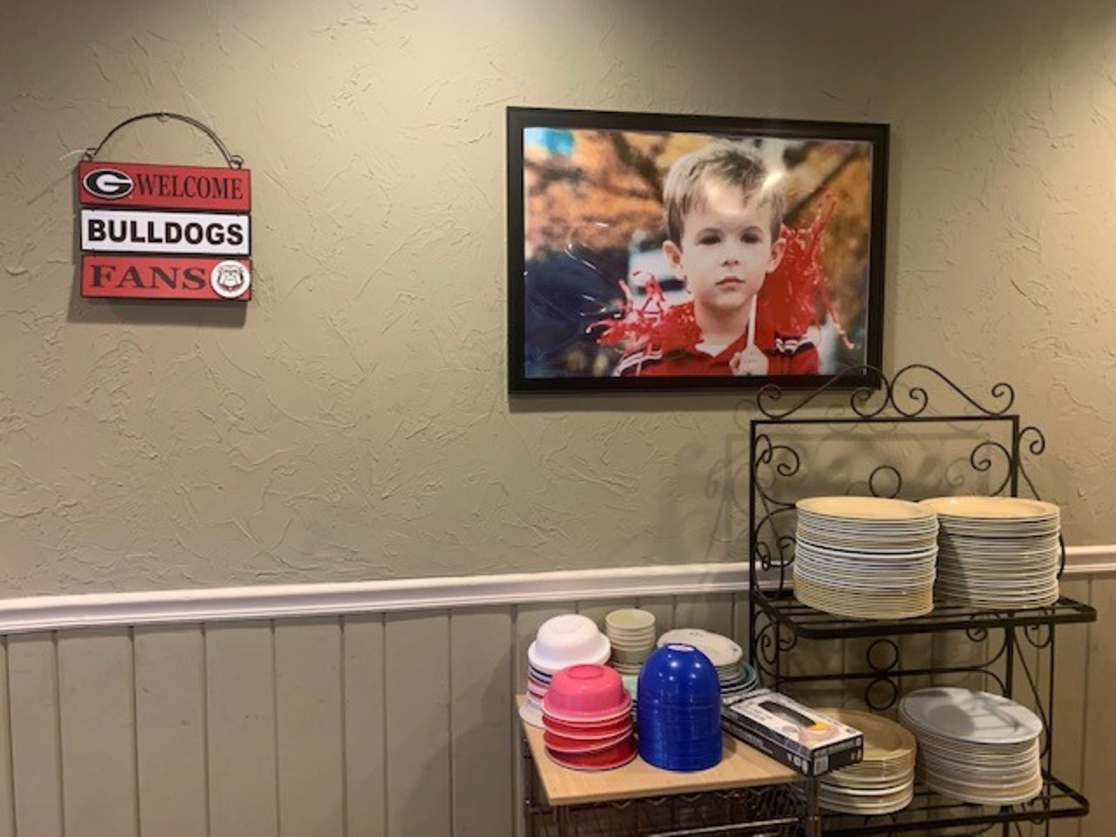 Photos of a young Stetson Bennett hang on the wall of the Oak Plaza Restaurant in Blackshear, Ga.