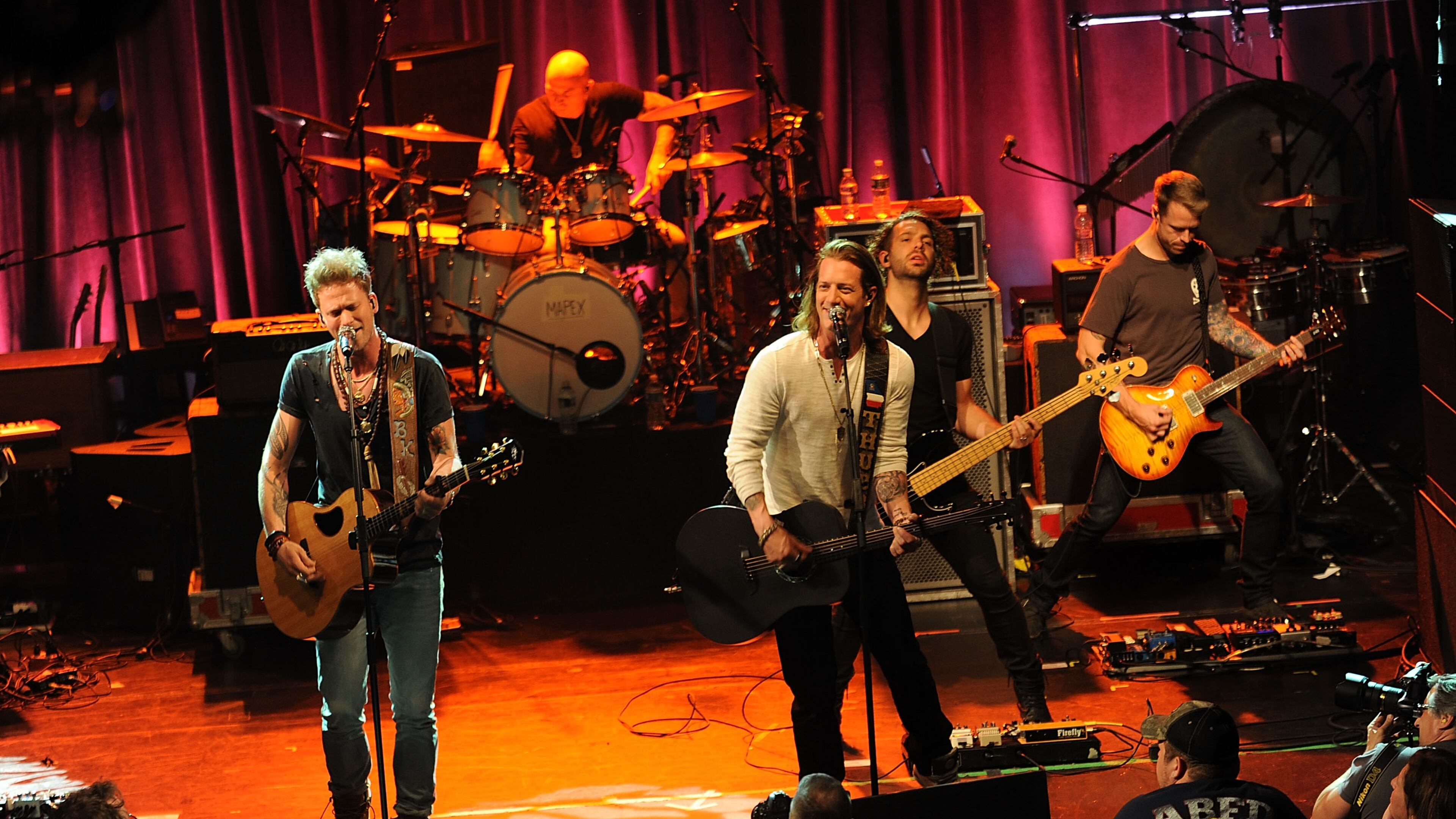 Musician Brian Kelley, left, and Tyler Hubbard of the music group Florida Georgia Line perform at National Concert Day at Irving Plaza on Tuesday, May 5, 2015 in New York. (Photo by Brad Barket/Invision/AP)