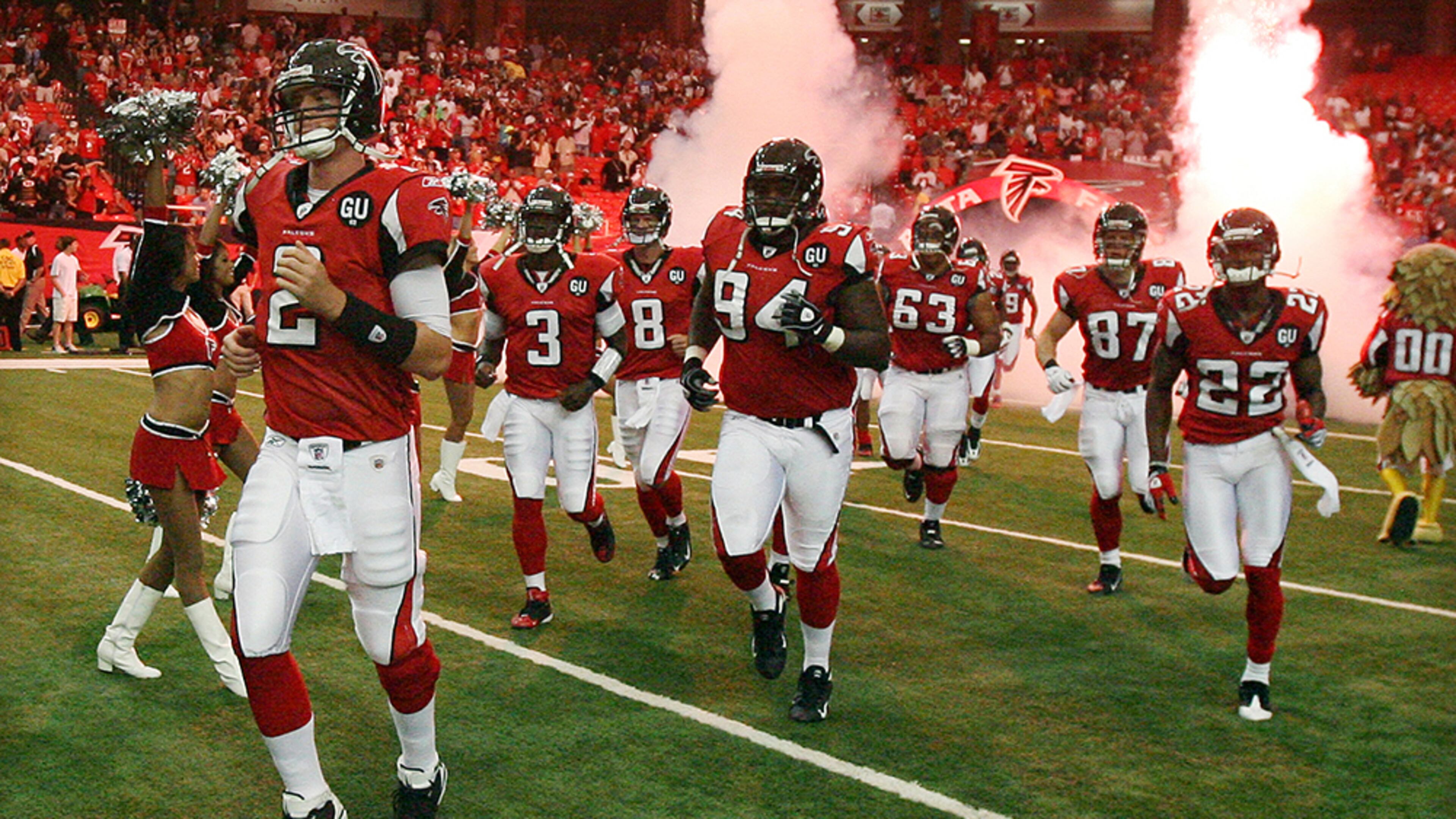 Matt Ryan leads the offense onto the field for his NFL debut Sunday, Sept. 7, 2008, at the Georgia Dome against the Detroit Lions. ( Curtis Compton/ AJC)