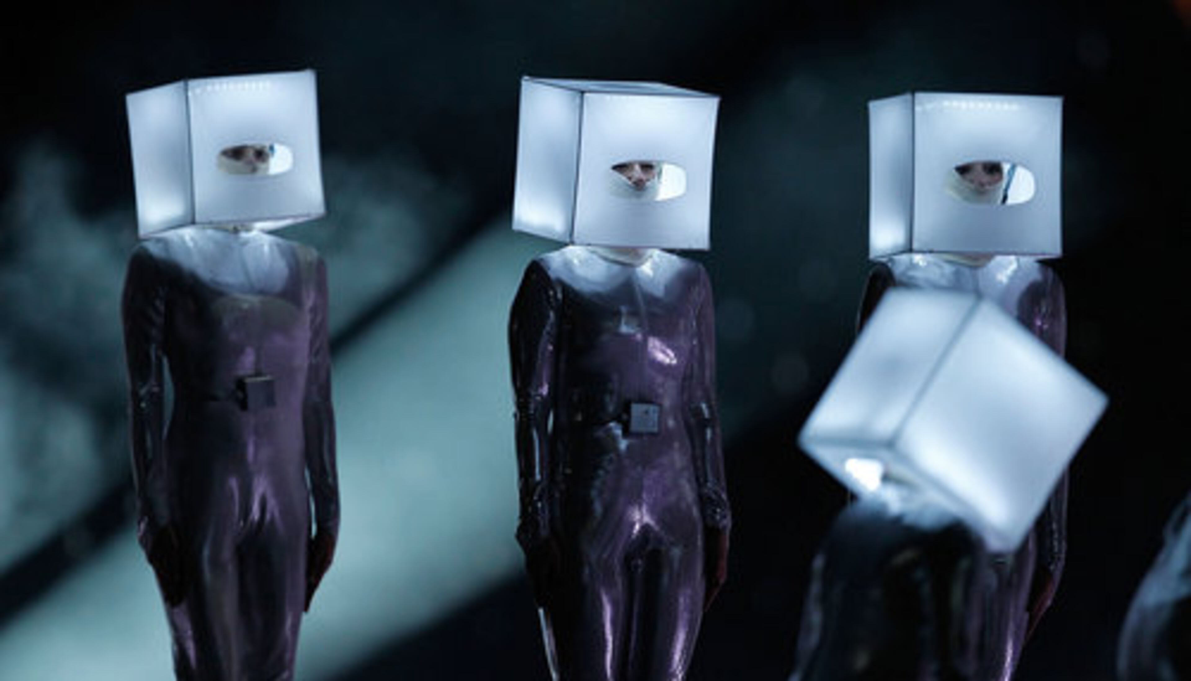 Dancers wore illuminated boxes over their heads during the Black Eyed Peas' performance. Is it hip to be square?