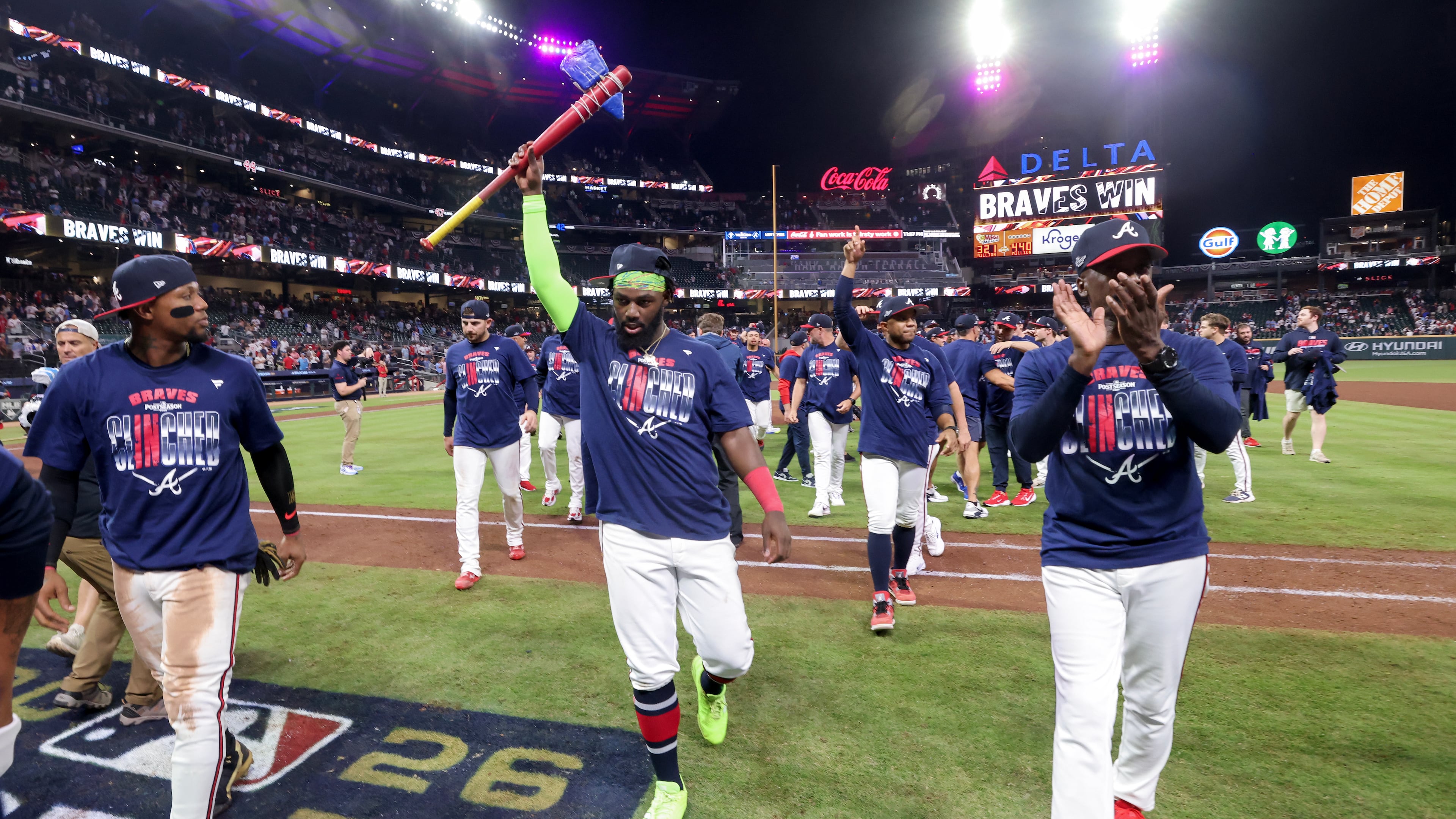 The Atlanta Braves including Michael Harris II (center) and Ronald Acuna Jr. (left) celebrate on the field after defeating the Philadelphia Phillies in Game 3 to win an MLB National League Wild Card playoff series between the Atlanta Braves and the Philadelphia Phillies, Thursday, Oct. 1, 2026, in Atlanta. (Jason Getz/AJC)