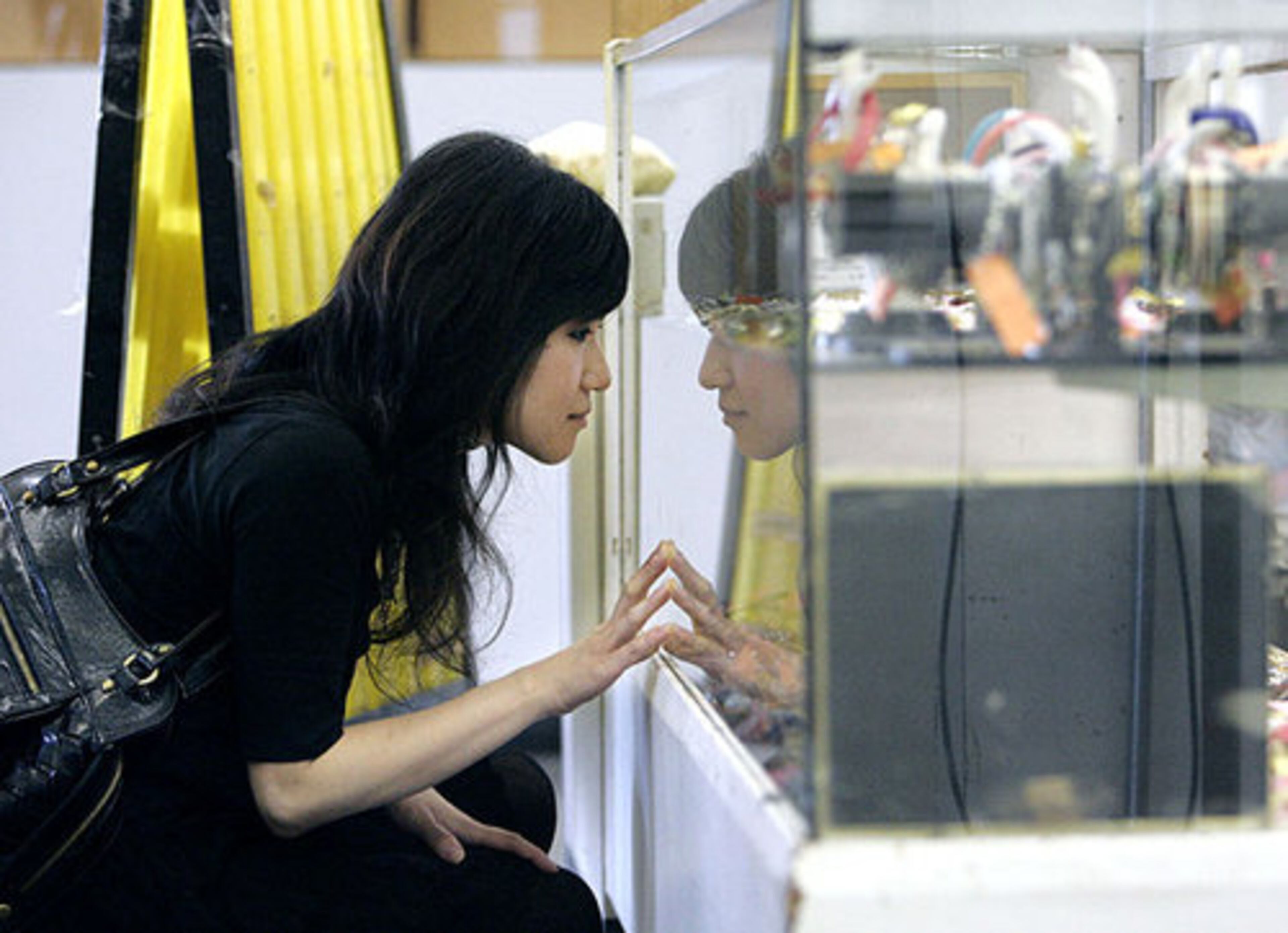 Wendy Cha examines the jewelry case at Bargain City.