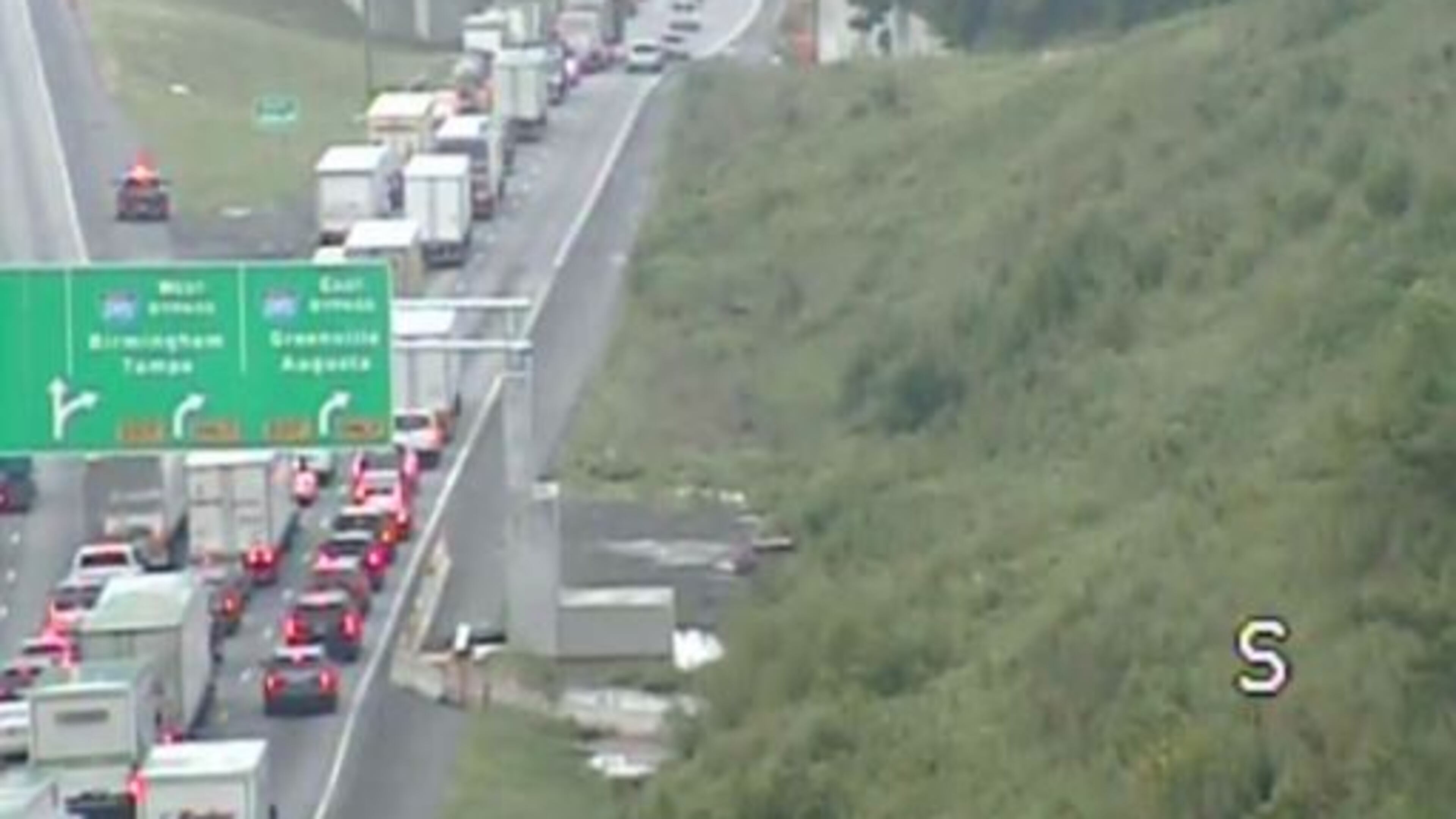 A tractor-trailer lost its load of chicken guts Tuesday, temporarily closing an I-75 ramp in Cobb County. (Credit: Georgia Department of Transportation)