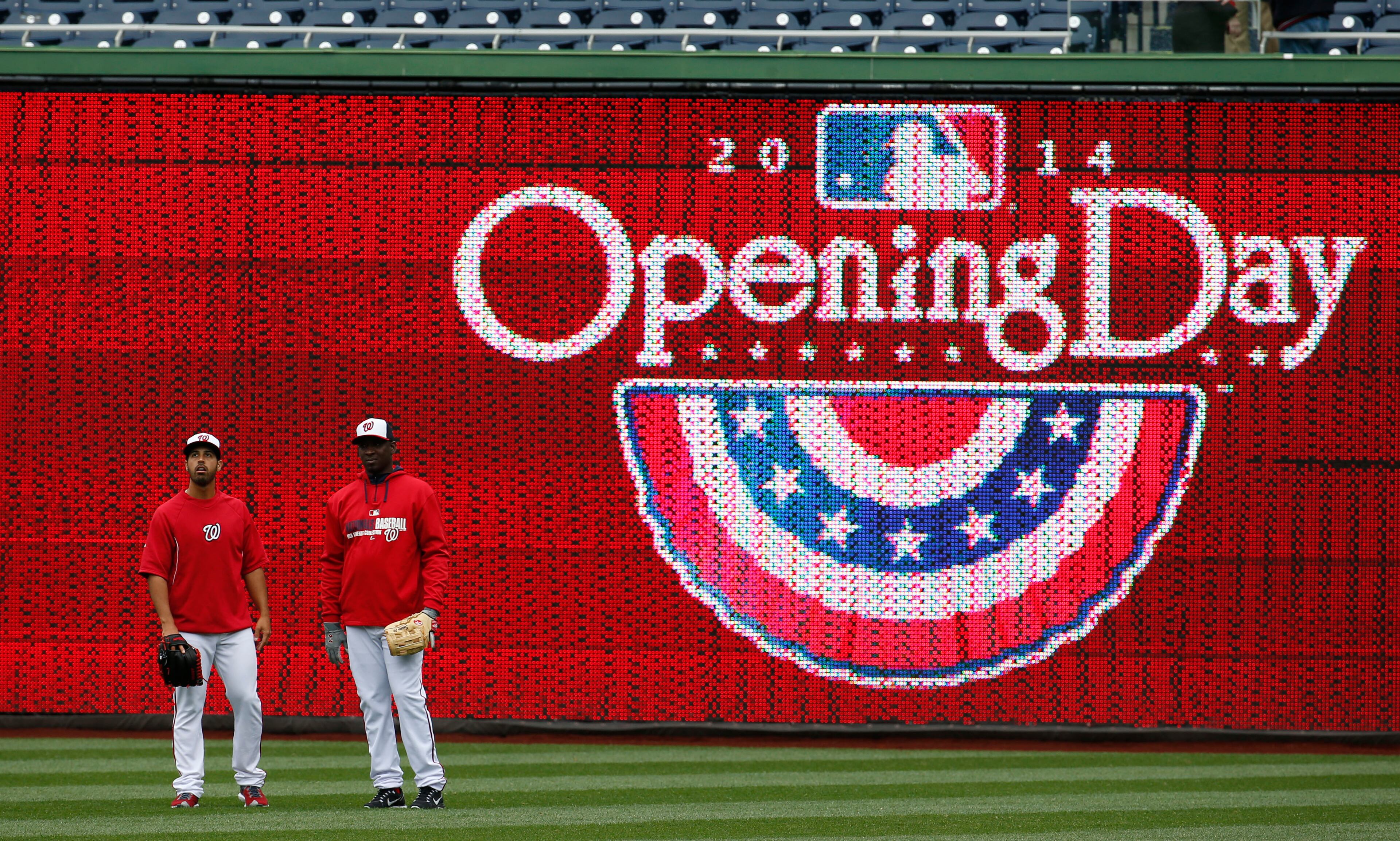 Washington Nationals starting pitcher Gio Gonzalez, left, and relief pitcher Rafael Soriano stand in the outfield before a baseball home opener against the Atlanta Braves at Nationals Park Friday, April 4, 2014, in Washington. (AP Photo/Alex Brandon)