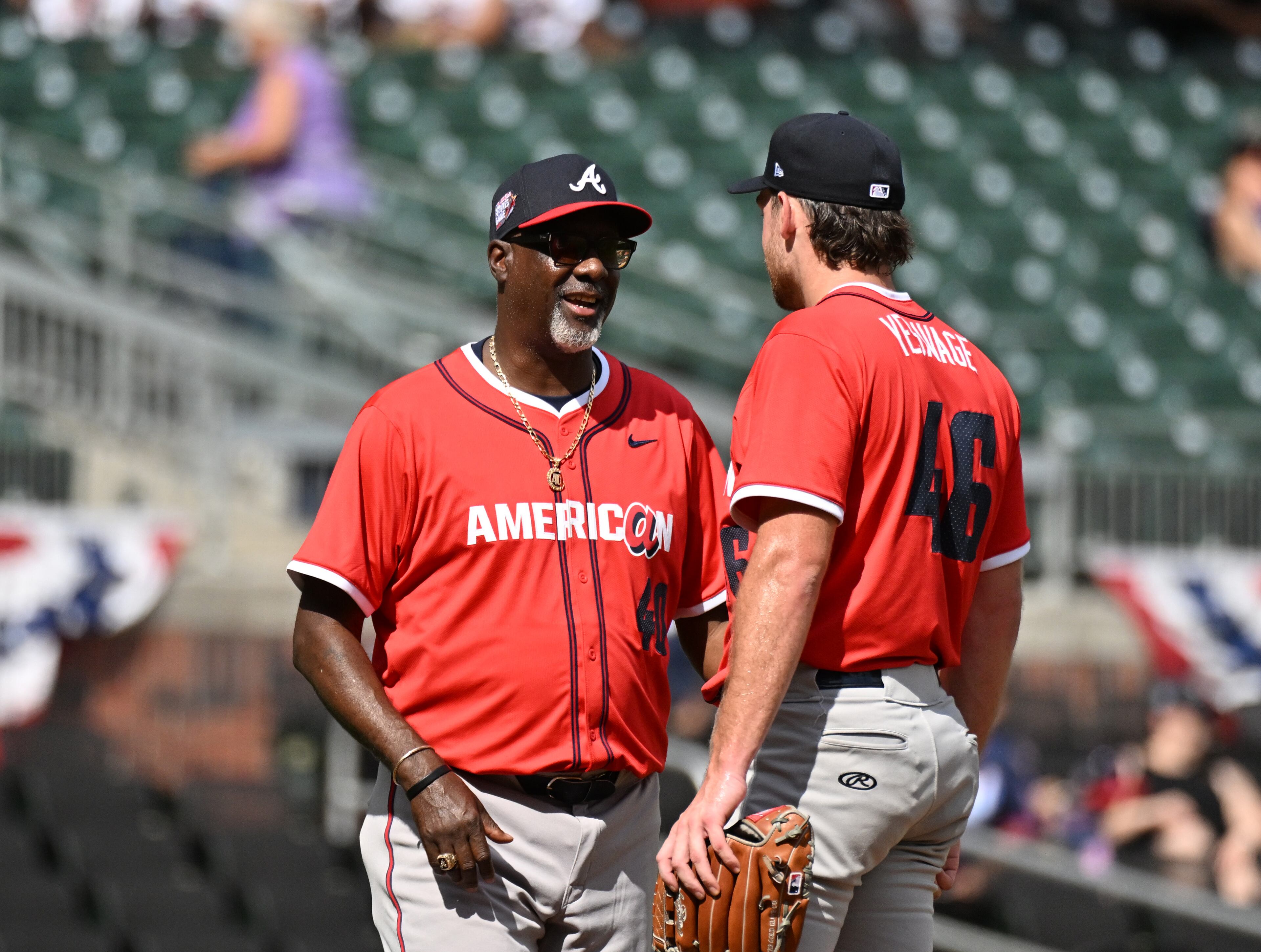 American League manager Marquis Grissom confers with American League pitcher Trey Yesavage (46) during the third inning of the All-Star Futures Game at Truist Park, Saturday, July 12, 2025, in Atlanta. National League won 4-2 over American League. (Hyosub Shin / AJC)