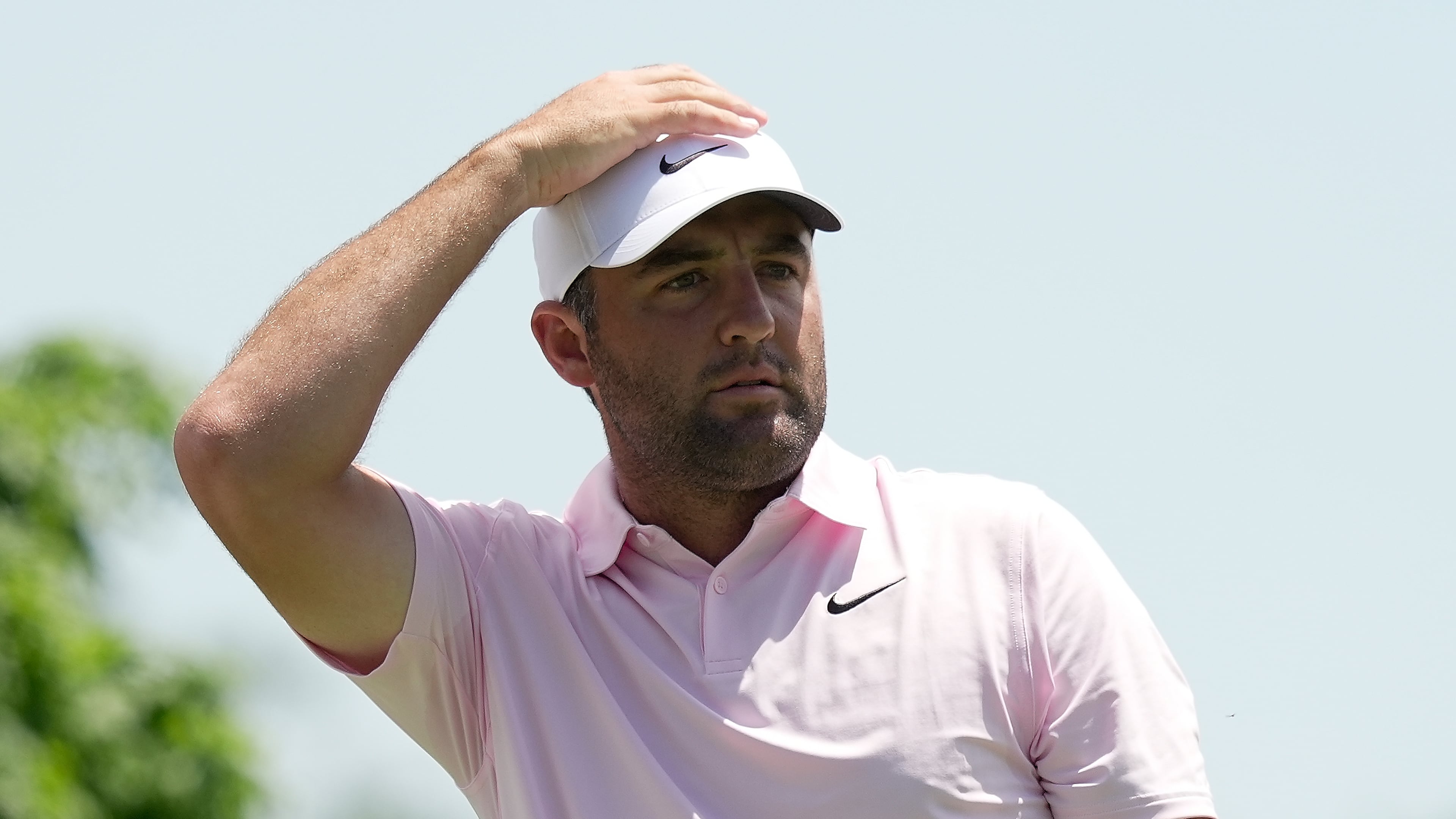 Scottie Scheffler watches his tee shot from the fifth tee during the first round of the Memorial golf tournament in Dublin, Ohio, Thursday, June 4, 2026. (AP Photo/Sue Ogrocki)