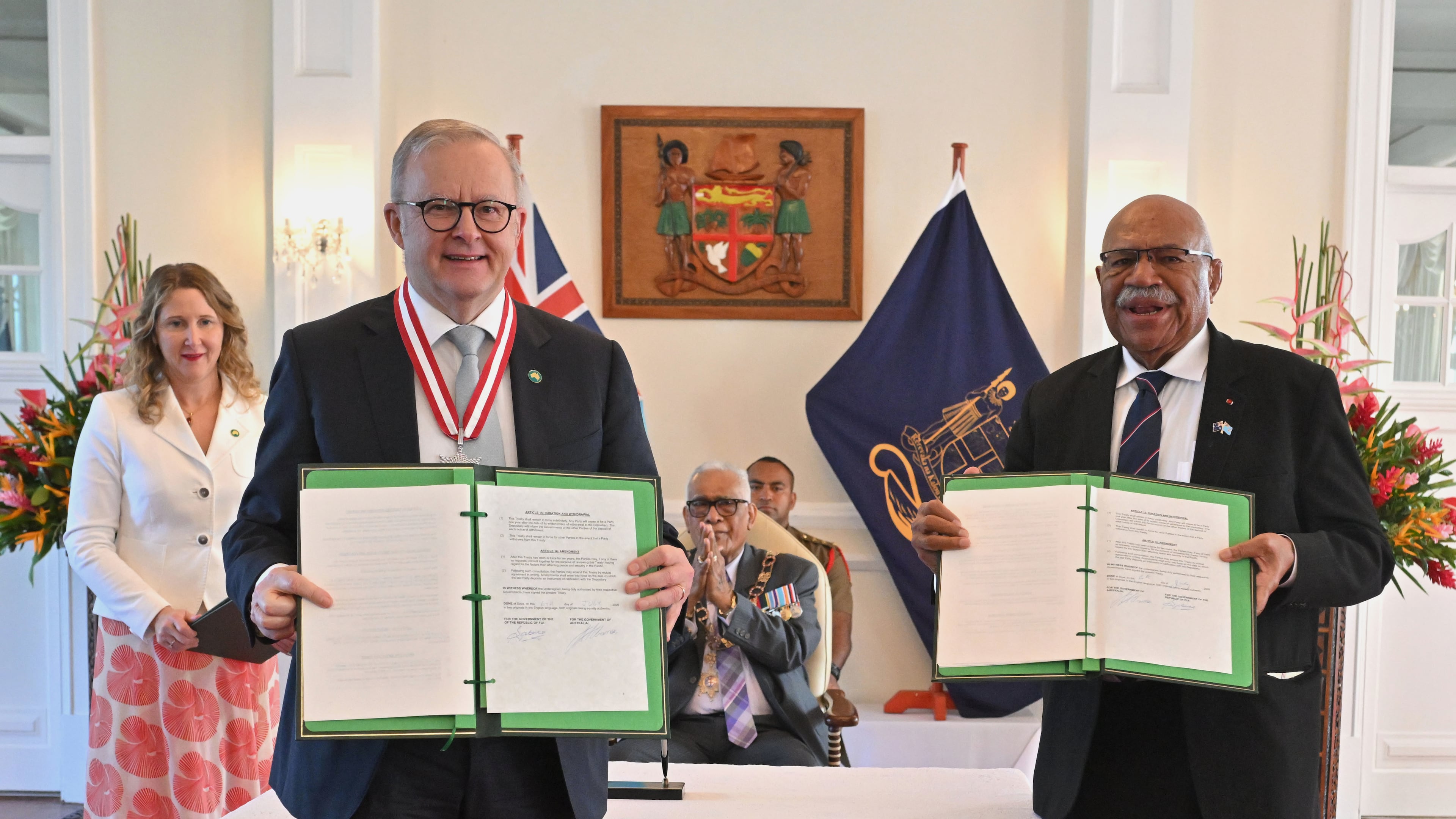 Australia's Prime Minister Anthony Albanese, left, and Fiji's Prime Minister Sitiveni Rabuka display a new bilateral defense alliance they have just signed at State House in Suva, Fiji, Monday, July 6, 2026. (Mick Tsikas/AAP Image via AP)