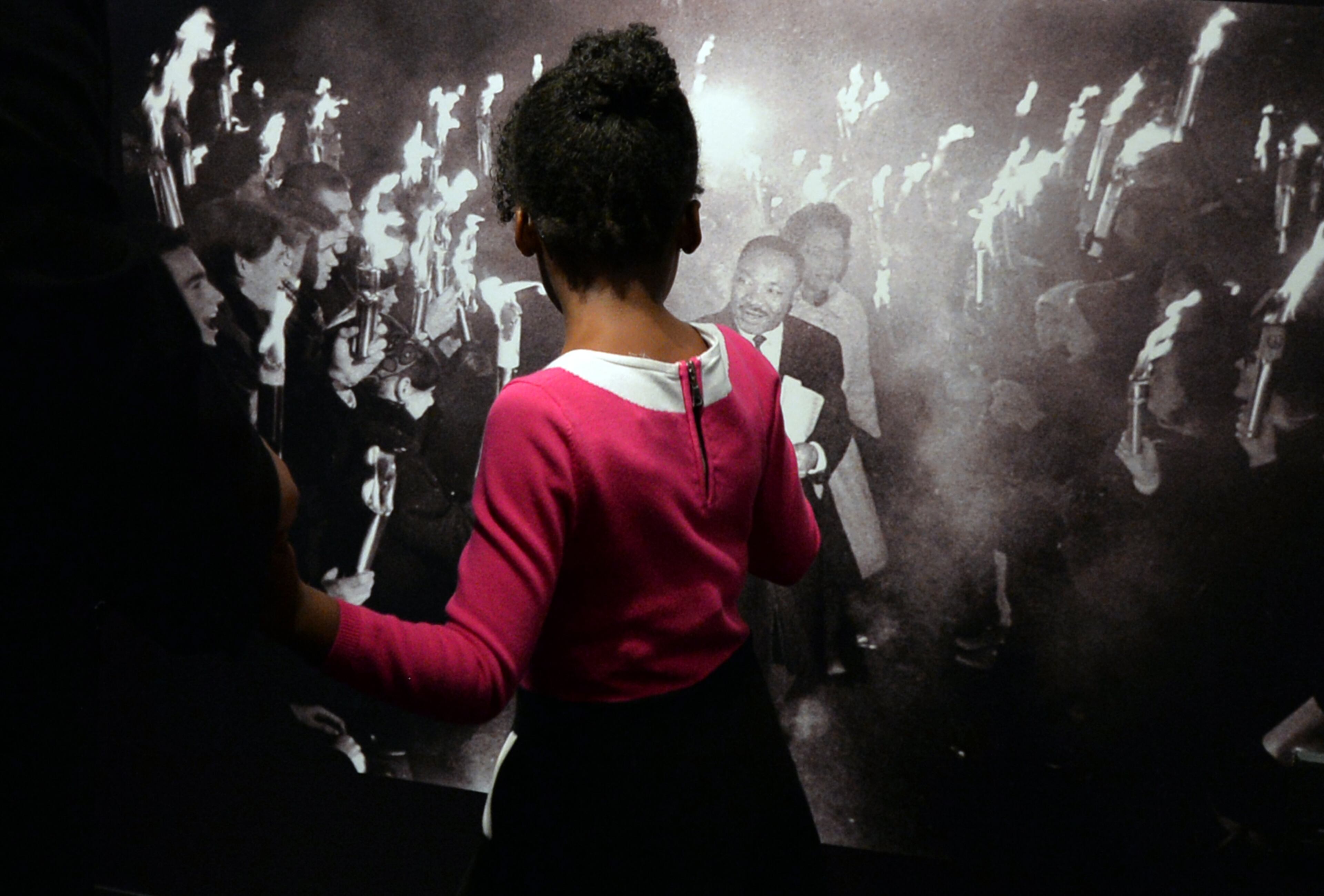 Yolanda Renee King, granddaughter of Martin Luther King Jr. points out a photo of the civil right leaders, while taking a tour of the exhibit with her dad, Martin Luther King Jr. III. The two were attending the grand opening exhibition of "1964 Martin Luther King, Jr." at the Martin Luther King, Jr. National Historic Site. Since 1964, the documents relating to the Nobel Peace Prize award nominations, notes and reports have been classified as a secret, and kept under lock and key in the Norwegian Nobel Committee's extensive archive. For the first time, the public now has access to this material. The exhibition features primary documents from the Nobel Peace Center in Oslo, Norway, Coca-Cola Corporate Archives, Ebenezer Baptist Church Archival Collections, Auburn Avenue Research Library on African American Culture and History, and Georgia State University Archival Collection. BRANT SANDERLIN / BSANDERLIN@AJC.COM
