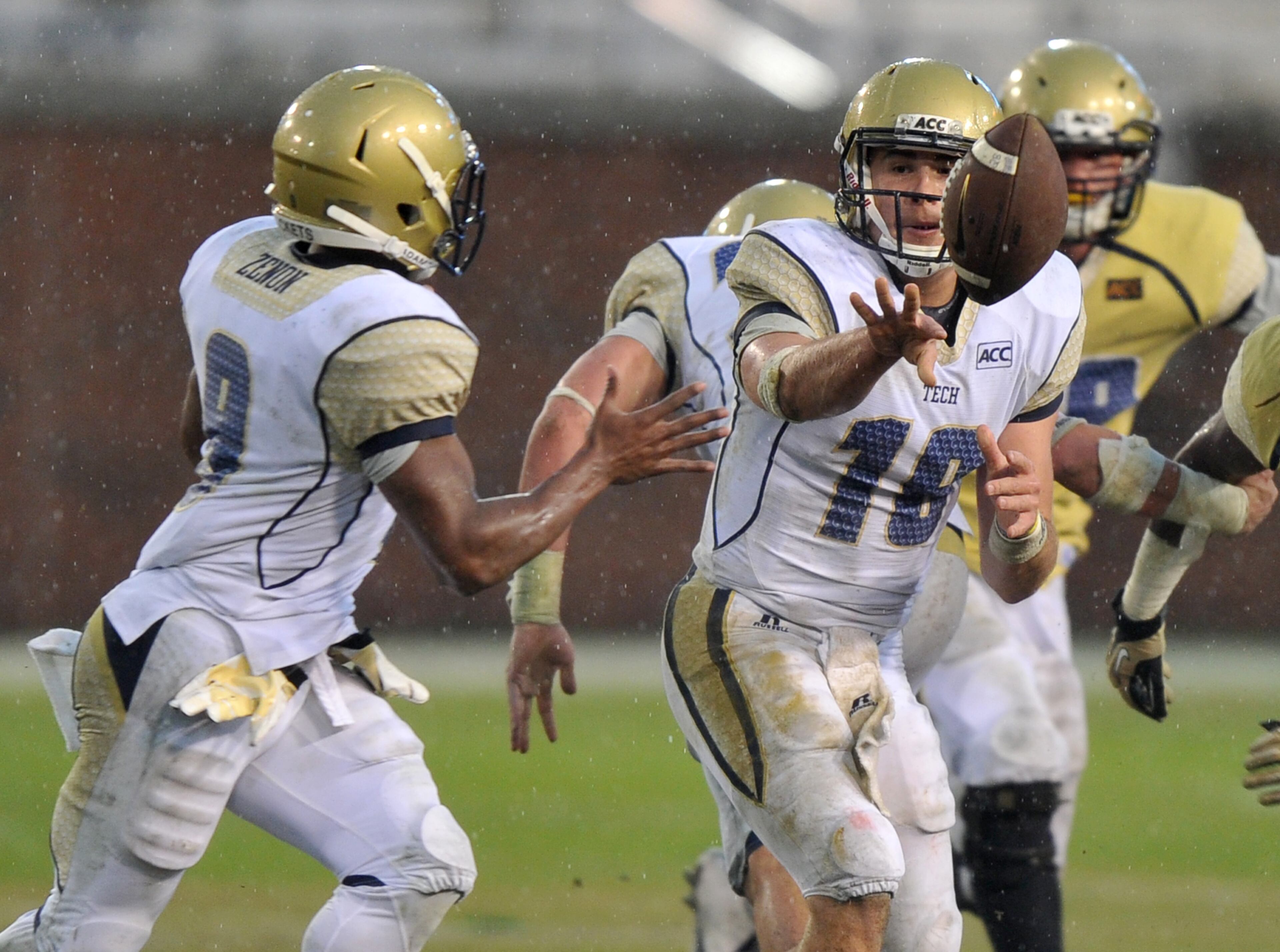 Quarterback Tim Byerly options to Tony Zenon during Georgia Tech's spring game at Bobby Dodd Stadium on Friday, April 18, 2014.