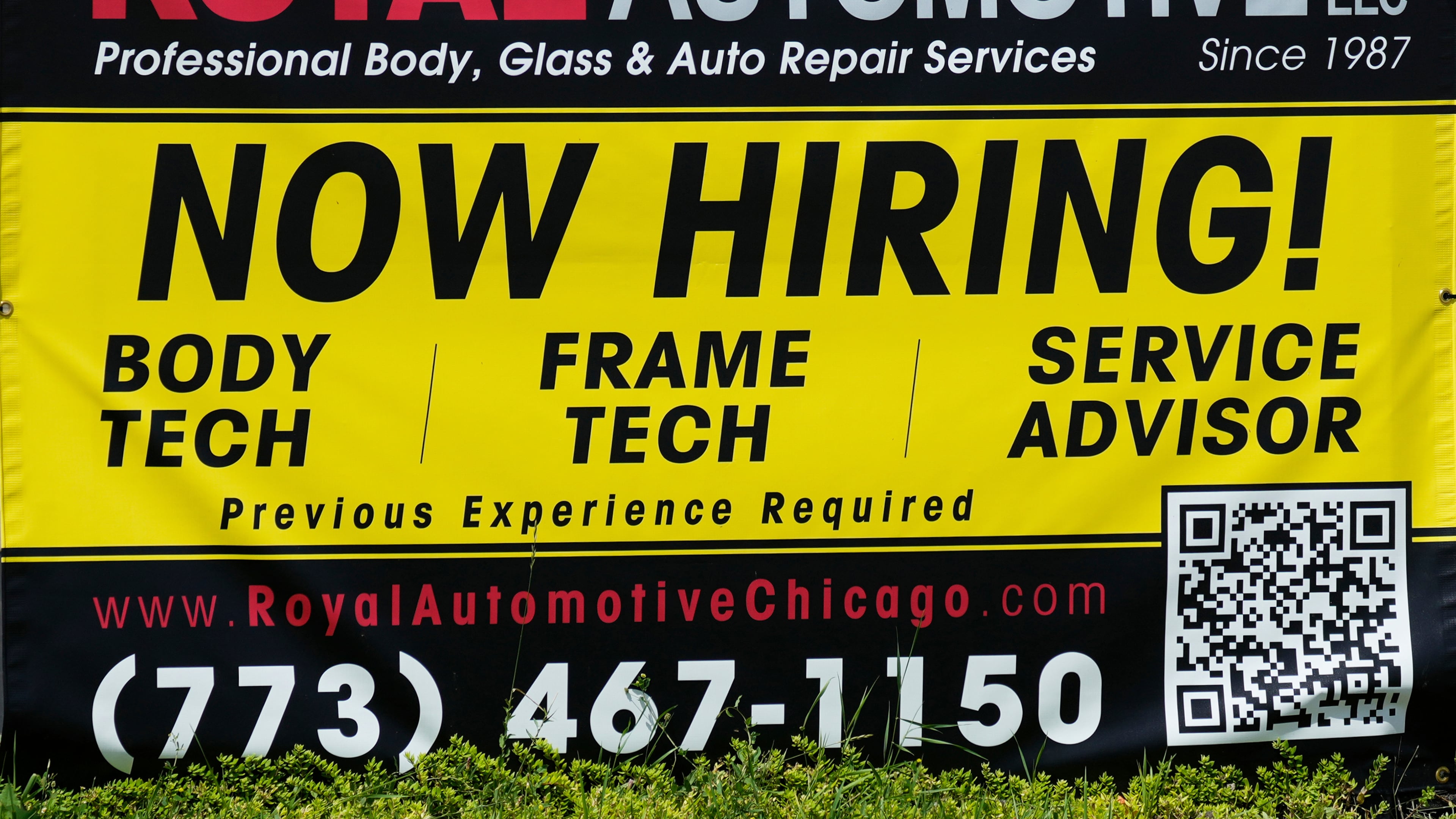 FILE - A now hiring sign is seen in front of an auto body shop in Chicago, June 25, 2026. (AP Photo/Nam Y. Huh, file)