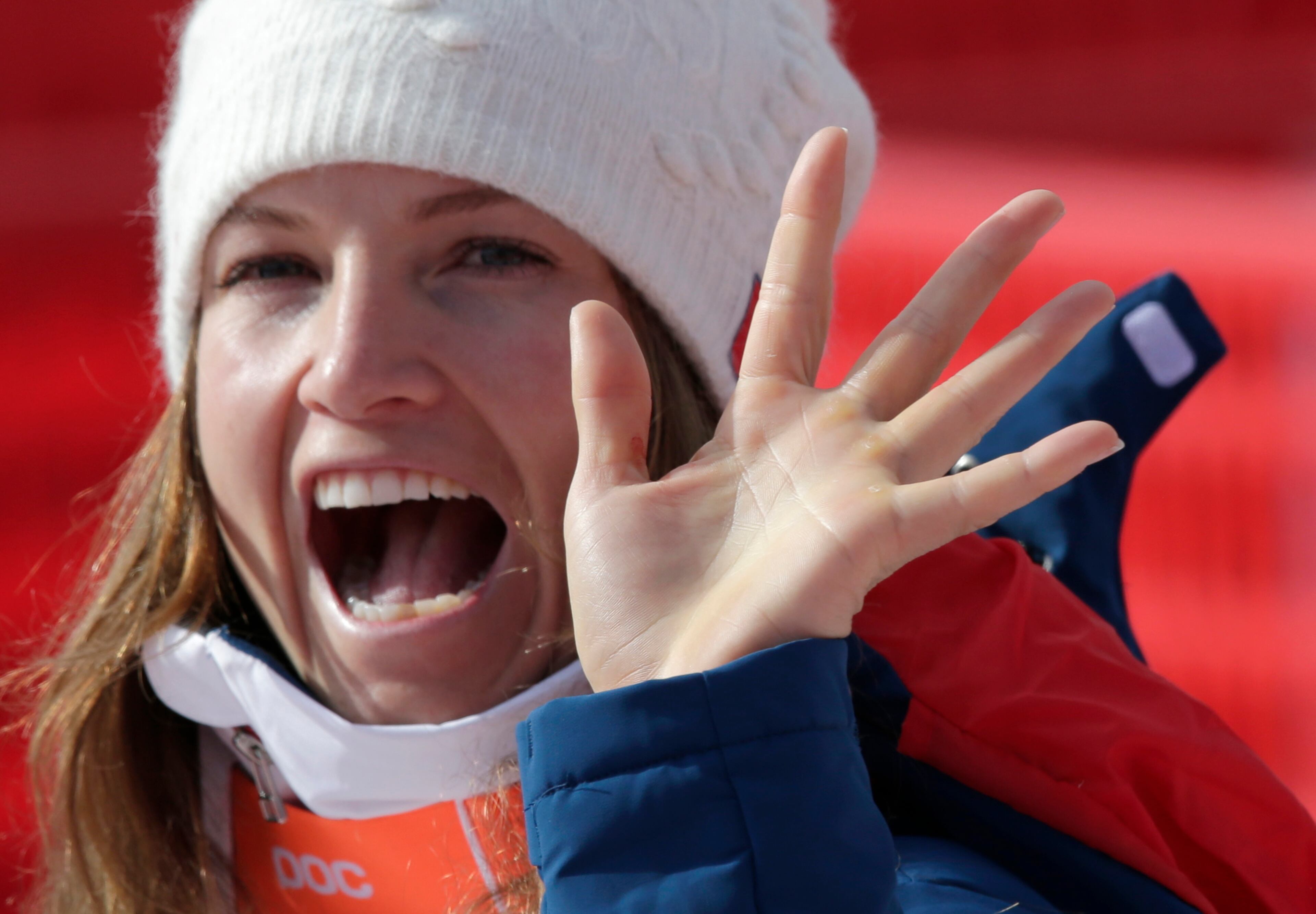 United States' Julia Mancuso waves as she leaves the finish area after the downhill portion of the women's supercombined at the Sochi 2014 Winter Olympics, Monday, Feb. 10, 2014, in Krasnaya Polyana, Russia. (AP Photo/Gero Breloer)
