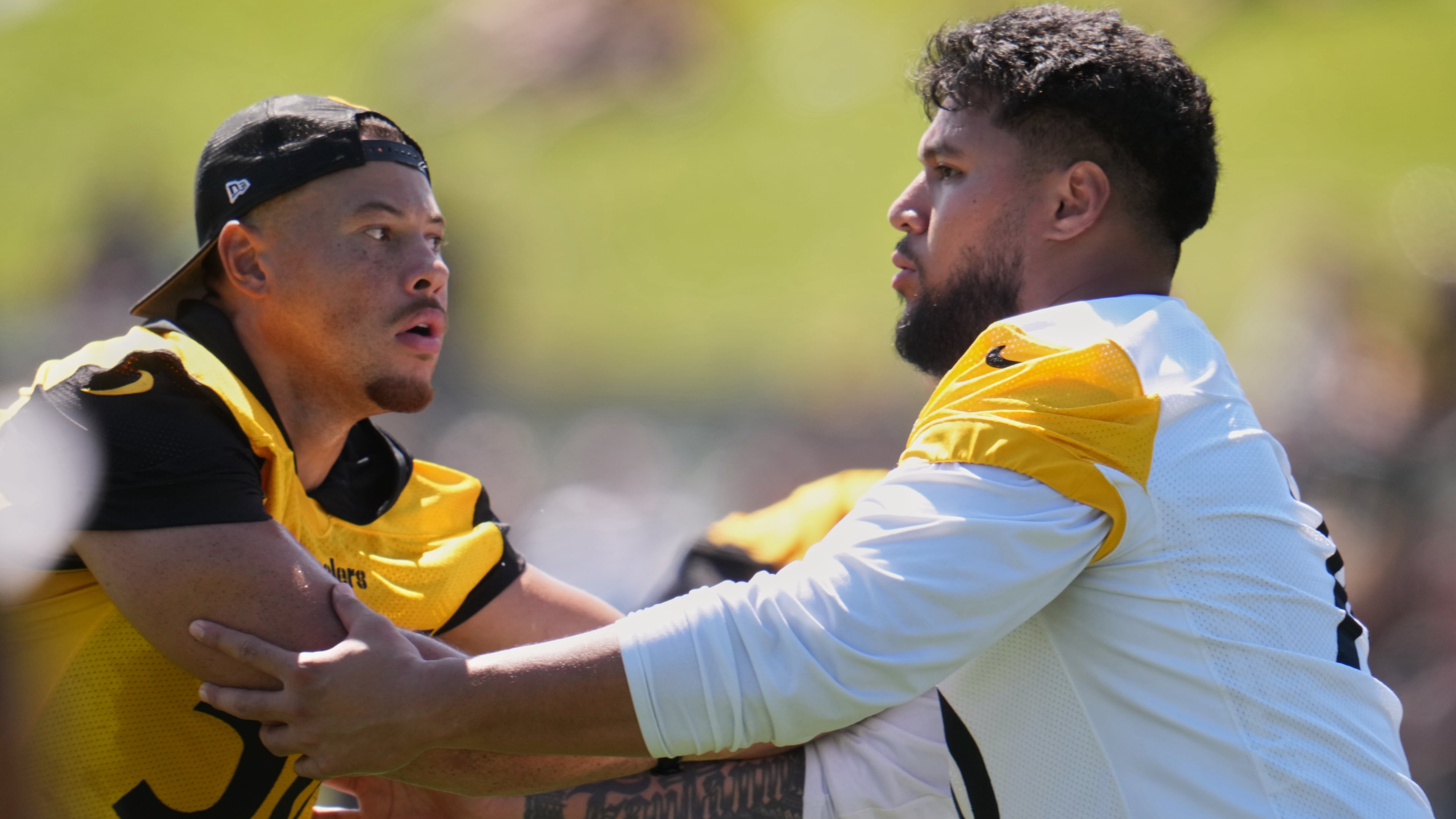 Pittsburgh Steelers linebacker Alex Highsmith (56), left, is blocked by offensive tackle Troy Fautanu during the team's NFL football training camp in Latrobe, Pa., on Friday, July 31, 2026.(AP Photo/Gene J. Puskar)