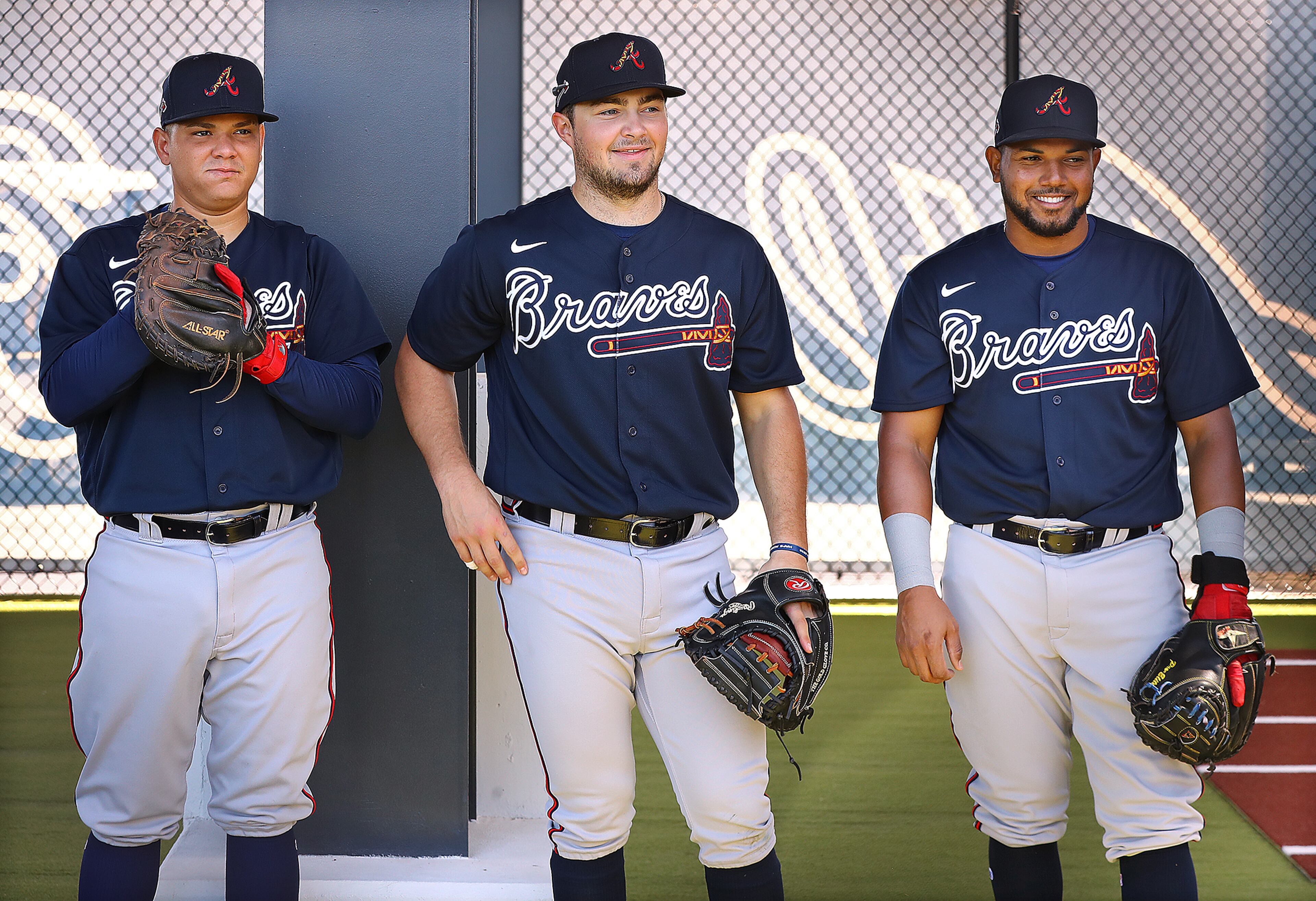 Braves catchers (from left) Jonathan Morales, Shea Langeliers, and Carlos Martinez prepare for work in the pen during spring training on Saturday, Feb. 15, 2020, in North Port. Curtis Compton ccompton@ajc.com