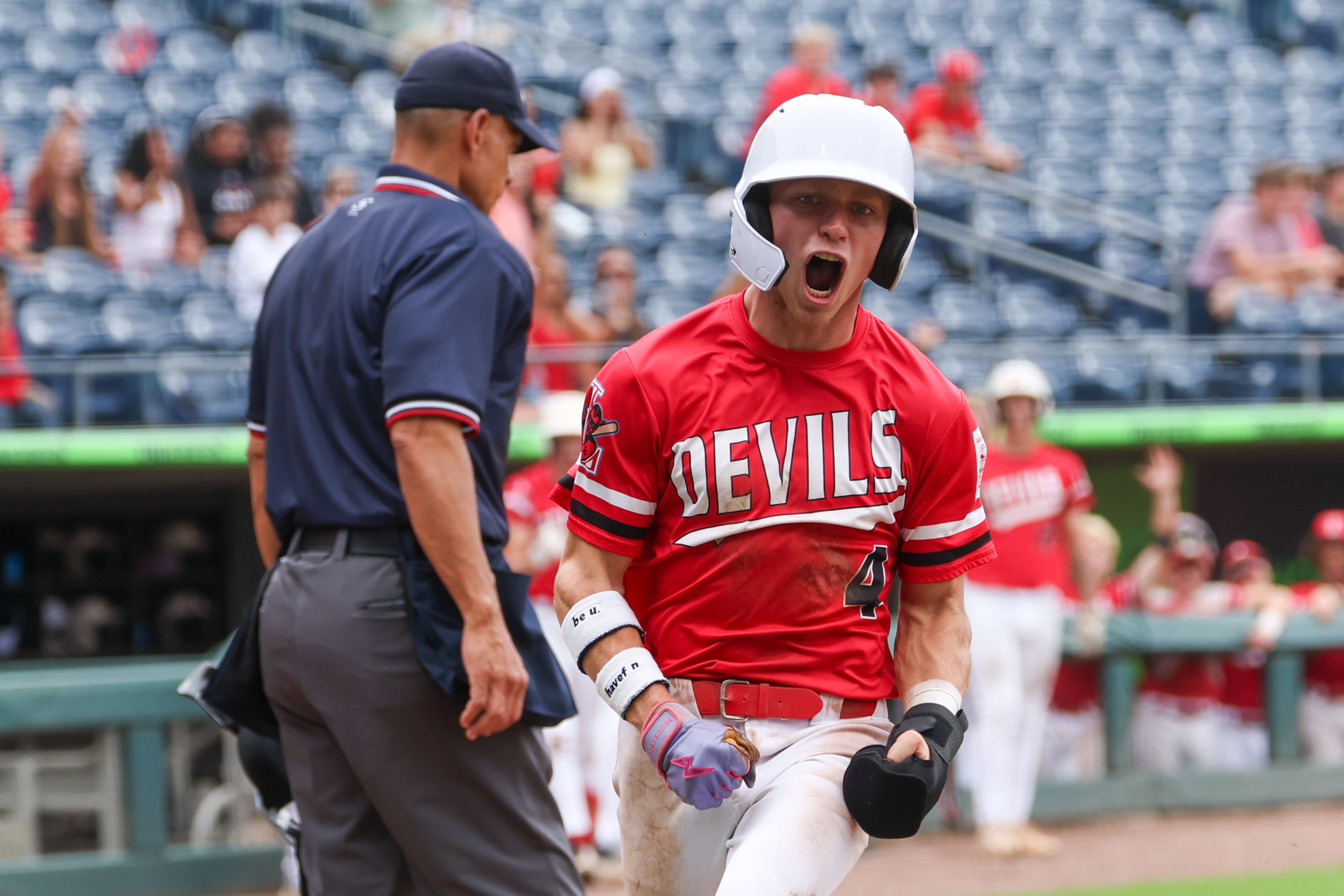Loganville’s Aiden Gorvett scores during the fourth inning in Game 2 of their GHSA Class 5A baseball championship series against Pope at Gwinnett Field on Tuesday, May 26, 2026, in Lawrenceville. (Arvin Temkar/AJC)