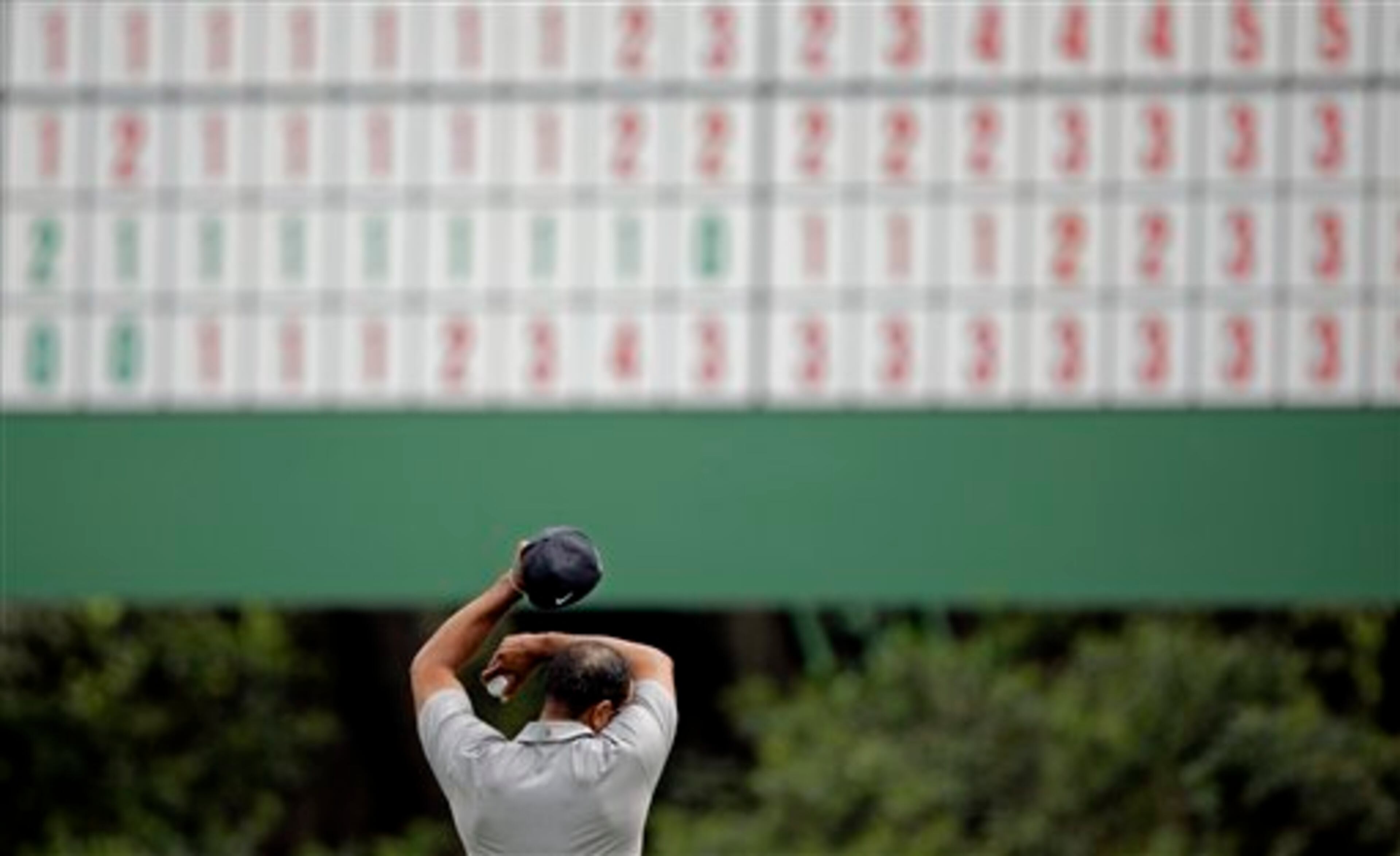 Tiger Woods wipes his forehead on the 11th green during the first round of the Masters golf tournament Thursday, April 11, 2013, in Augusta, Ga. (AP Photo/Matt Slocum)